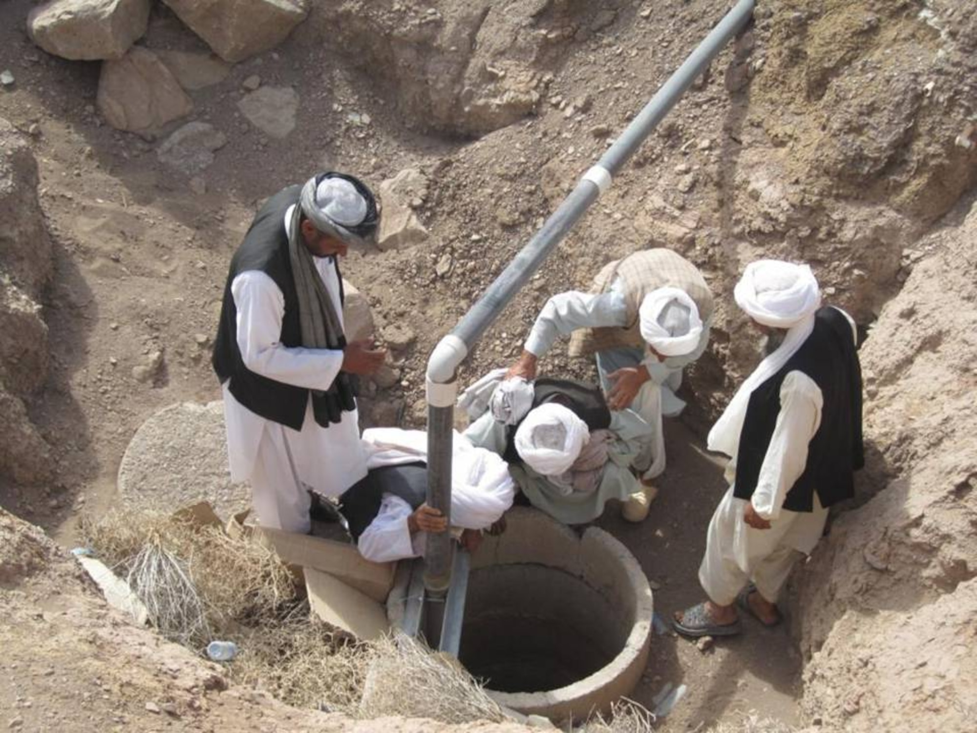 SHINDAND, Afghanistan - Village elders from Deh Ali Baig inspect the new well known as a “karez” at Shindand Air Base will help to increase the village’s water supply and help with their crop irrigation on Aug. 5, 2010.  