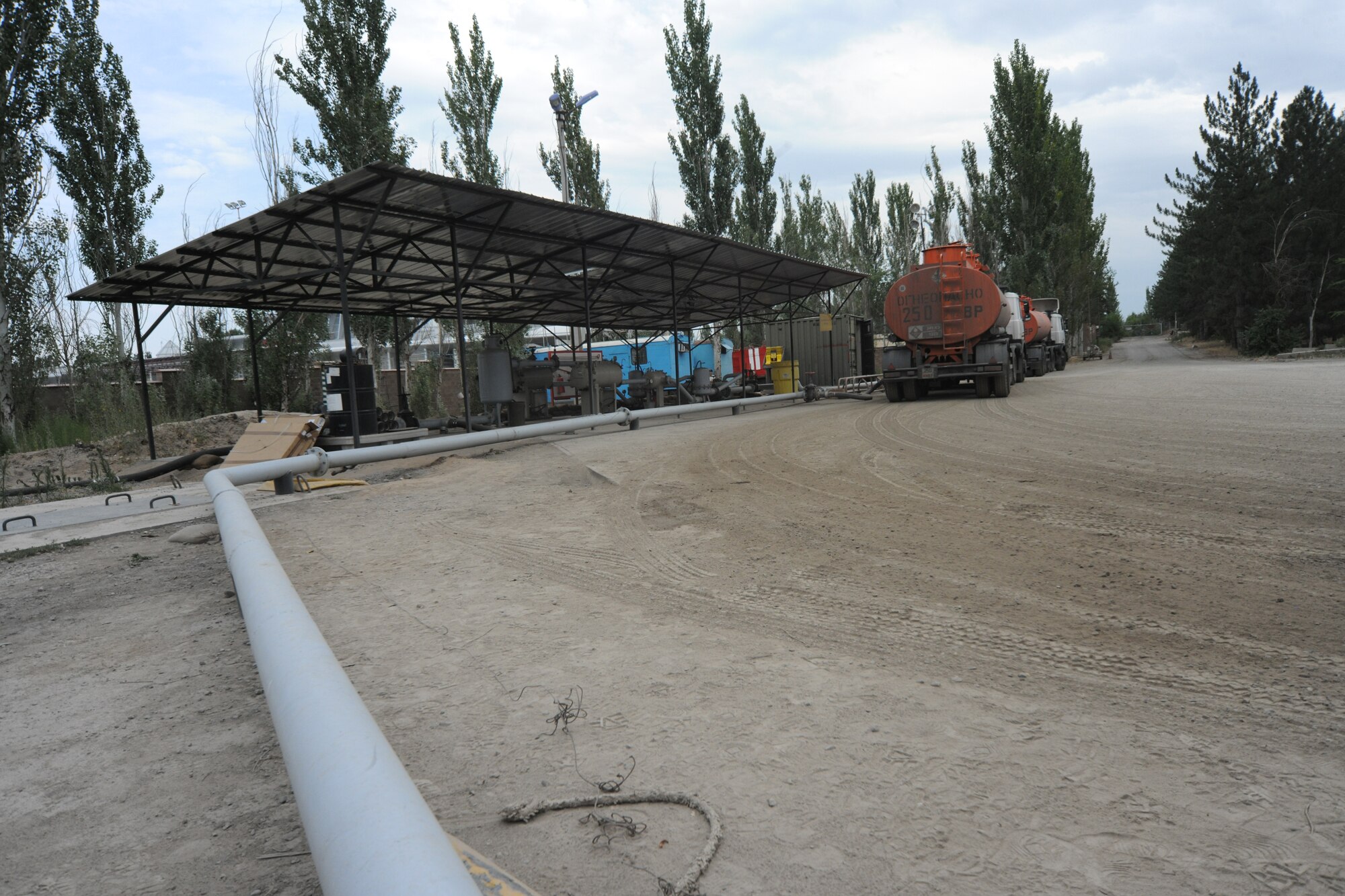 TRANSIT CENTER AT MANAS, Kyrgyzstan - The header, or the receiving point for fuel, is where Airmen tests and unloads it from about 40-60 trucks per day. More than 320,000 gallons are pumped through the intricate maze of pipes and hoses through filtration and storage systems at the Transit Center. (U.S. Air Force photo/Staff Sgt. Nathan Bevier)