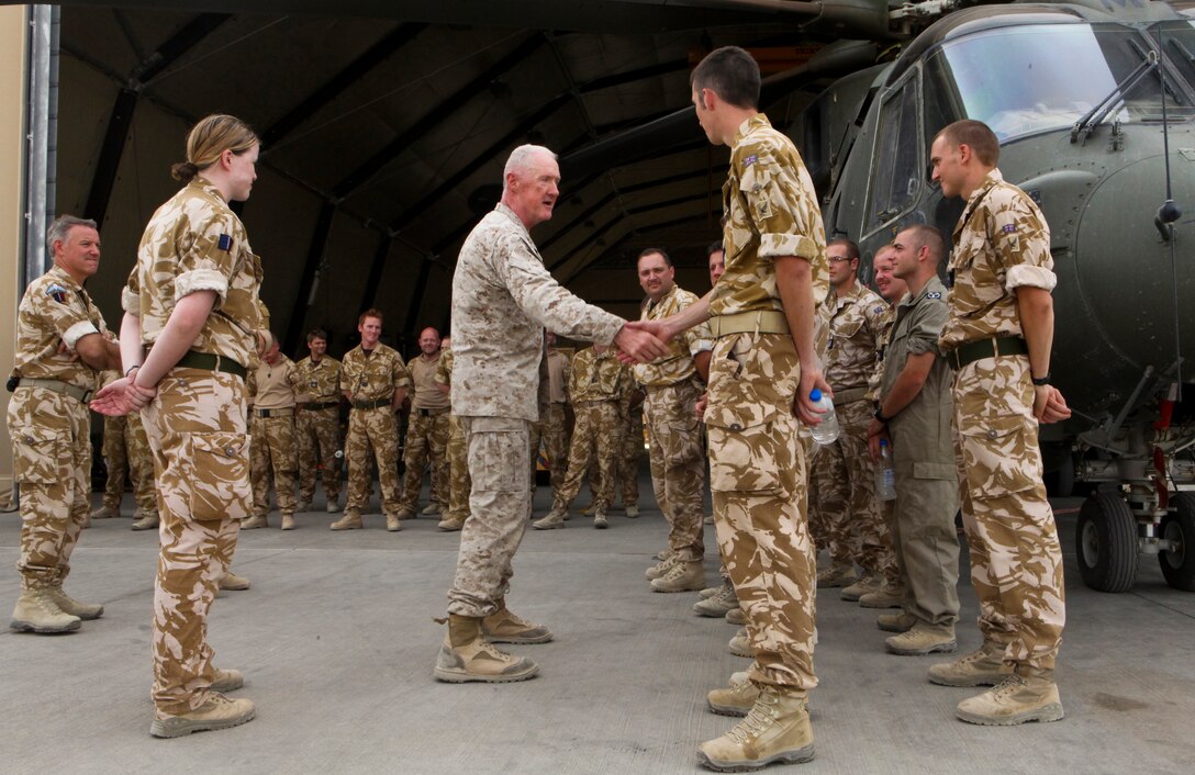 Maj. Gen. Richard Mills, commanding general of Regional Command Southwest, thanks maintainers, aircrew and pilots with the U.K.'s Joint Helicopter Force (Afghanistan) during a tour of the unit's flight line here August 7.  Mills spoke with many of the junior service members and thanked them for their hard work and professionalism.   JHF(A), along with U.S. squadrons under the 3rd Marine Aircraft Wing (Forward), provide everything from assault support to cargo delivery for Afghan National Security and NATO forces in Helmand province.