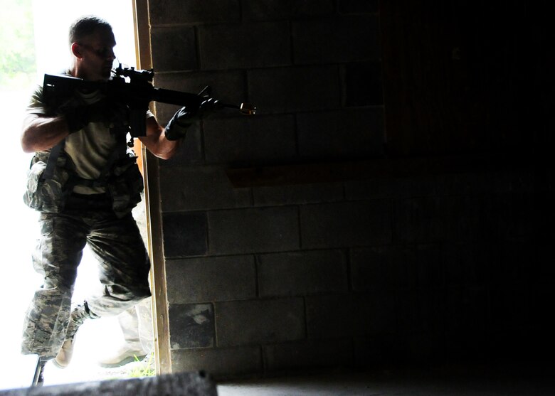 Staff Sgt. William Messer, 919th Security Forces Squadron, leads his fire team into a building during room-clearing training at Eglin Air Force Base Fla.  SFS teams practiced entry and clearing tactics and procedures with varying targets, objectives and ammunition Aug. 7.  Blanks and simulated munitions were used to create a more realistic scenario for the Reservists from Duke Field.  (U.S. Air Force photo/Tech. Sgt. Samuel King Jr.)