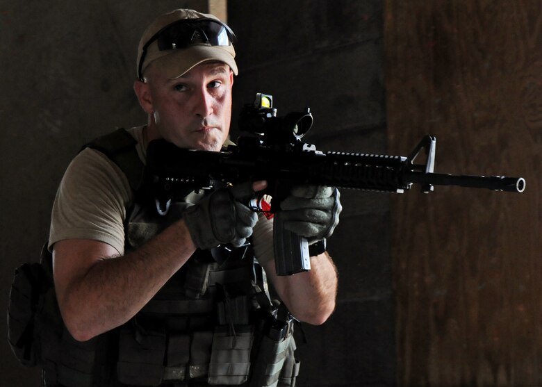 Master Sgt. William Stapp, 919th Security Forces Squadron, leads his team into the room during room-clearing training at Eglin Air Force Base Fla.  SFS teams practiced entry and clearing tactics and procedures with varying targets, objectives and ammunition Aug. 7.  Blanks and simulated munitions were used to create a more realistic scenario for the Reservists from Duke Field.  (U.S. Air Force photo/Tech. Sgt. Samuel King Jr.)
