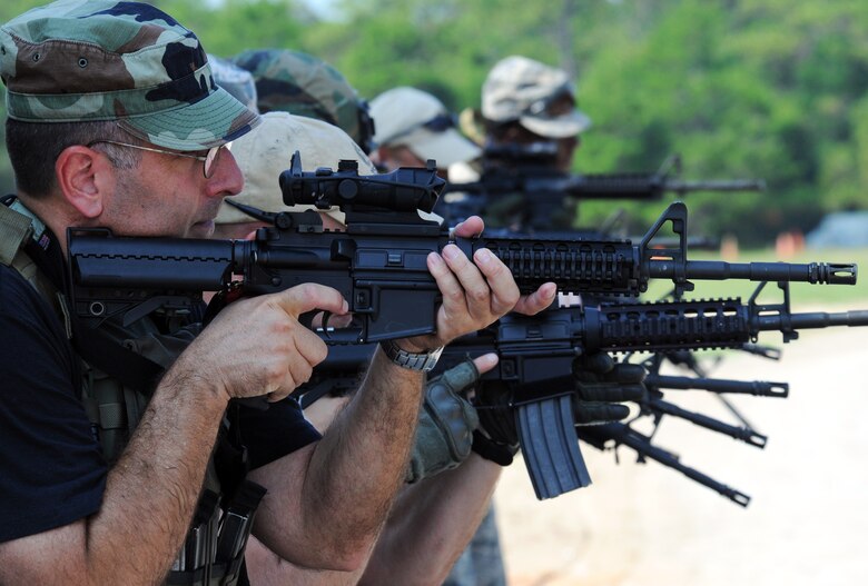 Tech. Sgt. Stephan Tterlikkas and other 919th Security Forces Squadron Airmen practice proper weapon procedures prior to room-clearing training at Eglin Air Force Base Fla. SFS teams practiced entry and clearing tactics and procedures with varying targets, objectives and ammunition Aug. 7.  Blanks and simulated munitions were used to create a more realistic scenario for the Reservists from Duke Field.  (U.S. Air Force photo/Tech. Sgt. Samuel King Jr.)