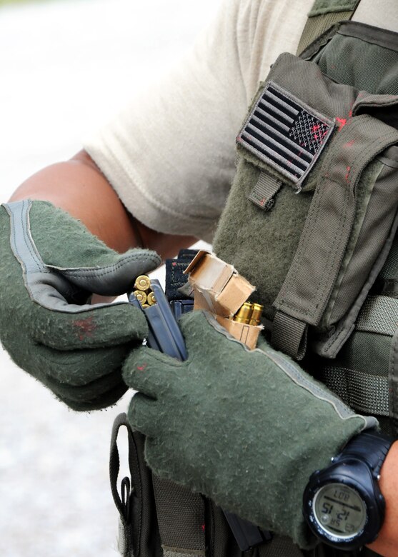 Blank rounds are loaded into a magazine prior to room-clearing training at Eglin Air Force Base Fla.  The SFS teams practiced entry and clearing tactics and procedures with varying targets, objectives and ammunition Aug. 7.  Blanks and simulated munitions were used to create a more realistic scenario for the Reservists from Duke Field.  (U.S. Air Force photo/Tech. Sgt. Samuel King Jr.)