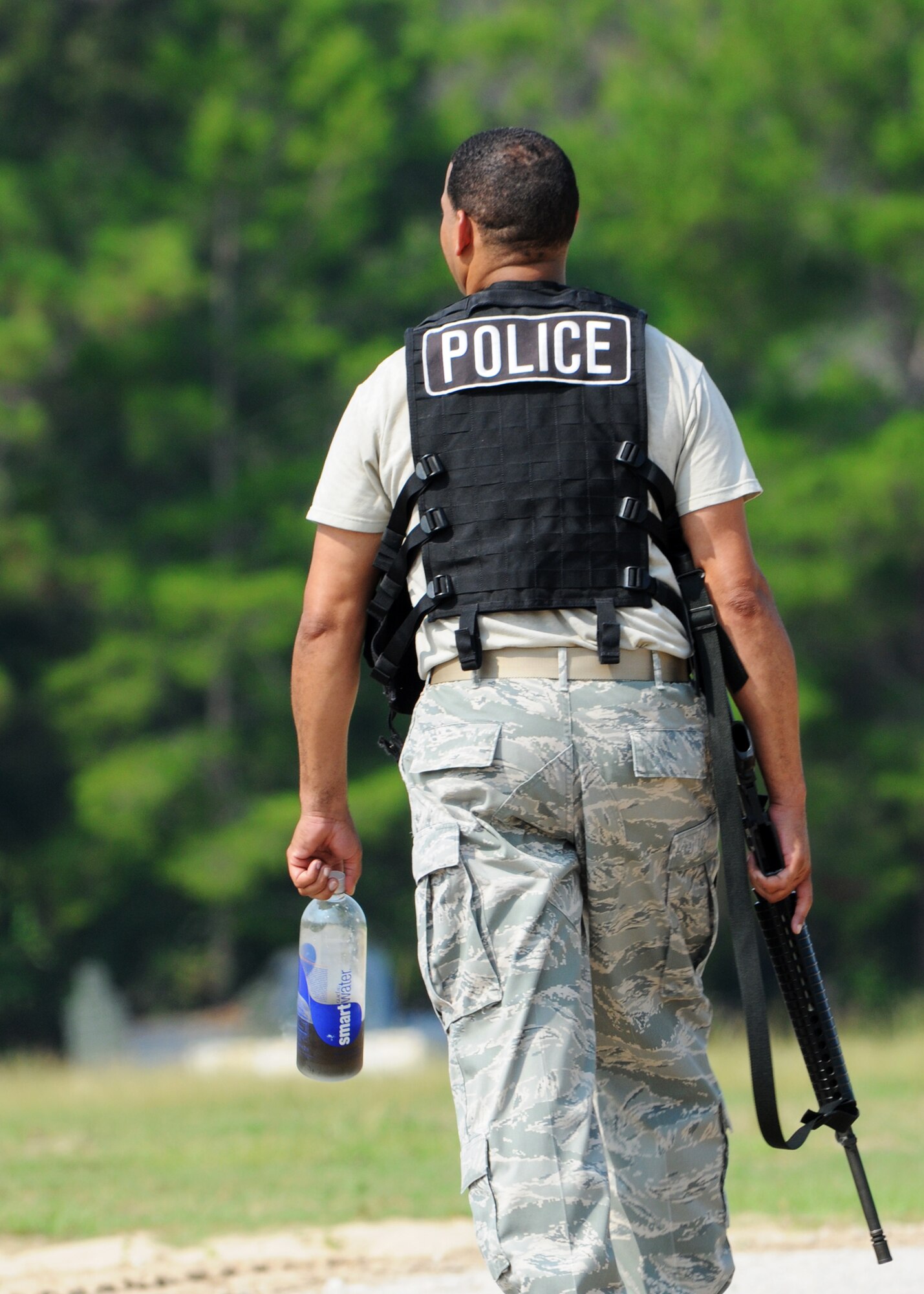 Tech. Sgt. John McDowell, 919th Security Forces Squadron, walks toward the next training stop, Improvised Explosive Device identification, on a hot Aug. 4 morning.  SFS Reservists from Duke Field participating in refresher training on IEDs, weapons, room clearing and neutralizing threats during the August UTA.  (U.S. Air Force photo/Tech. Sgt. Samuel King Jr.)