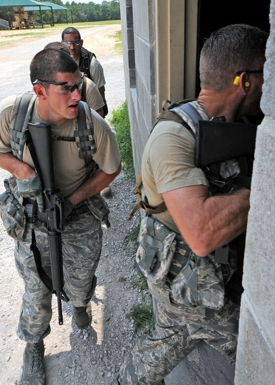 Tech. Sgt. Barry Bailey, 919th Security Forces Squadron, follows the fire team lead into a building during room-clearing training at Eglin Air Force Base Fla.  SFS teams practiced entry and clearing tactics and procedures with varying targets, objectives and ammunition Aug. 7.  Blanks and simulated munitions were used to create a more realistic scenario for the Reservists from Duke Field.  (U.S. Air Force photo/Tech. Sgt. Samuel King Jr.)