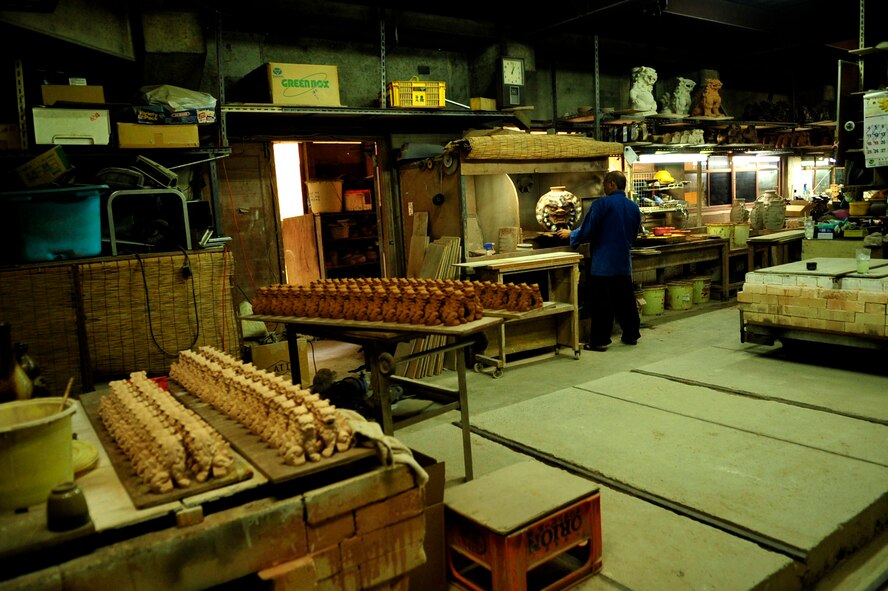 Mr. Hideo Miyagi, a famous Okinawan Potter, looks at the traditional Okinawan vase in the Chibana district of Okinawa July 15, 2010. (U.S. Air Force photo/Senior Airman Amanda Grabiec)