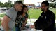 JOINT BASE LEWIS-MCCHORD, Wash.- Colin Brooks, (right) Adventures Unlimited manager at McChord Field here, explains some of the upcoming outdoor recreation events to Senior Airman Angela Leonardo, 313th Airlift Squadron and her husband Michael. Adventures Unlimited was one of the information booths that showcased its services and products during the 446th Airlift Wing's annual Family Day at Heritage Hill Aug. 7. (U.S. Air Fore photo/Staff Sgt. Nicole Celestine)