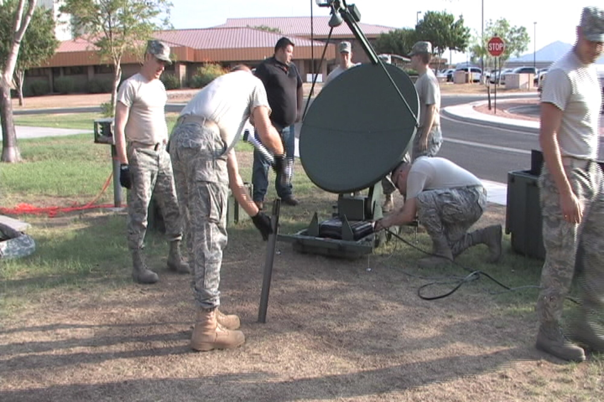 Ariz. Guardsmen assemble communication equipment as part of deploying the JISCC, July. 28, at Phoenix Sky Harbor Air National Guard Base. The JISCC bridges multiple communication gaps and opens the lines of communication between military and local agencies. (U.S. Air Force photo/Airman 1st Class Joshua Morrison)