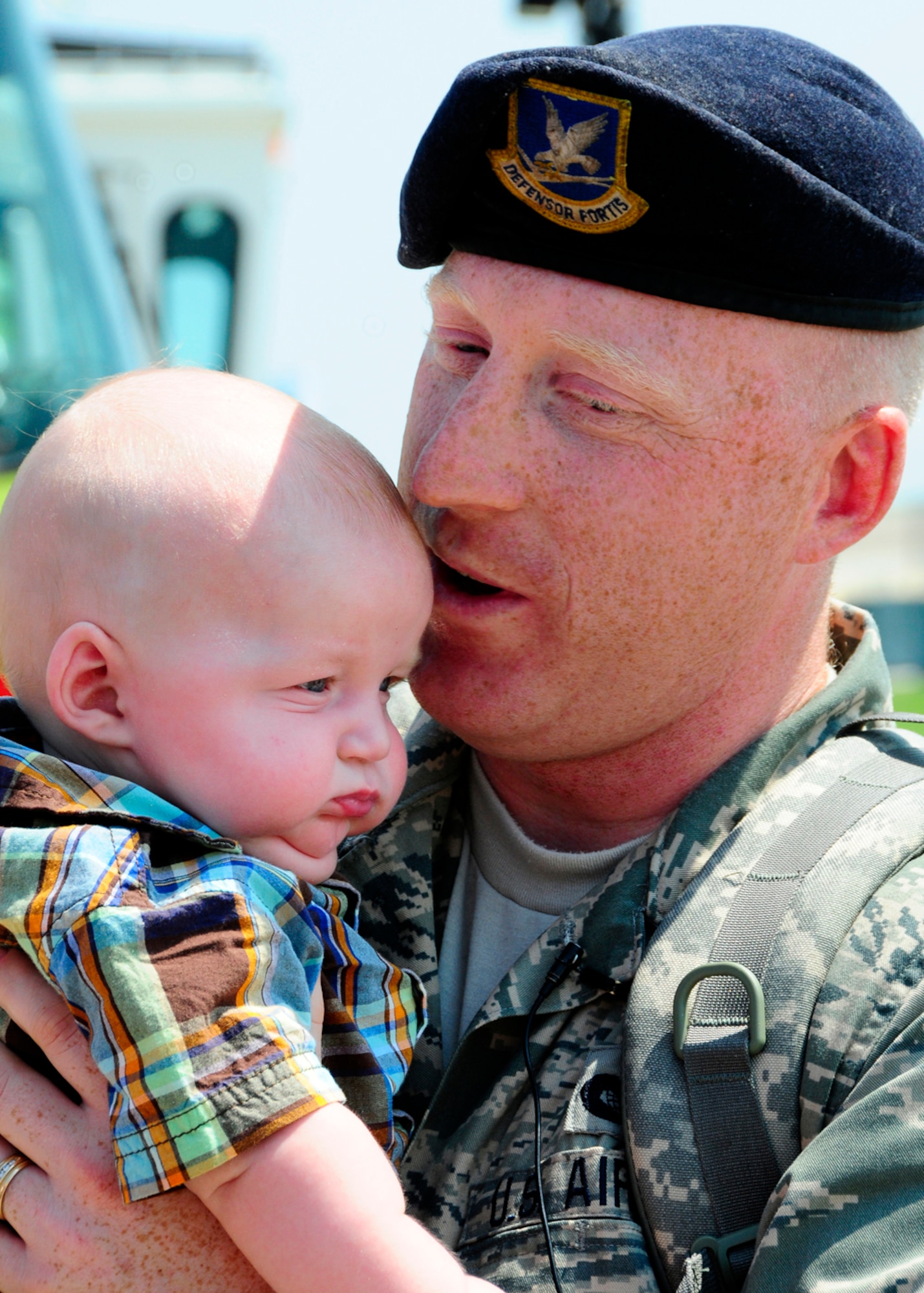 Master Sgt. Stan Drozdowski holds his son Talon Drozdowski for the very first time after returning from a six-month deployment to Iraq.  Drozdowski is a member of the 134 ARW Security Forces Squadron at McGhee Tyson Air National Guard Base, Tennessee.  (US Air Force photo by Tech. Sgt. Kendra M Owenby, 134 ARW Public Affairs)