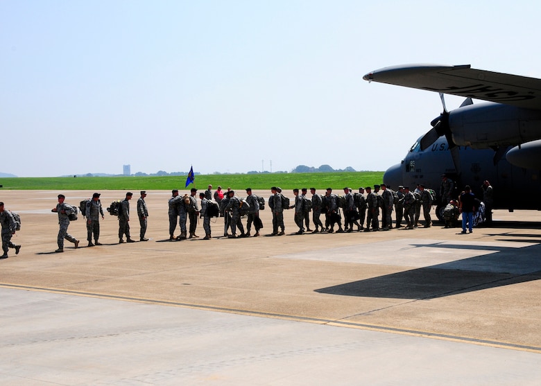 Members of the 134 ARW Security Forces Squadron, McGhee Tyson Air National Guard, file off of a c-130 aircraft after returning home from a six-month deployment to Iraq.  (US Air Force photo by Tech. Sgt. Kendra M Owenby, 134 ARW Public Affairs, Released by Capt. Gary Taft, 134 ARW PAO)