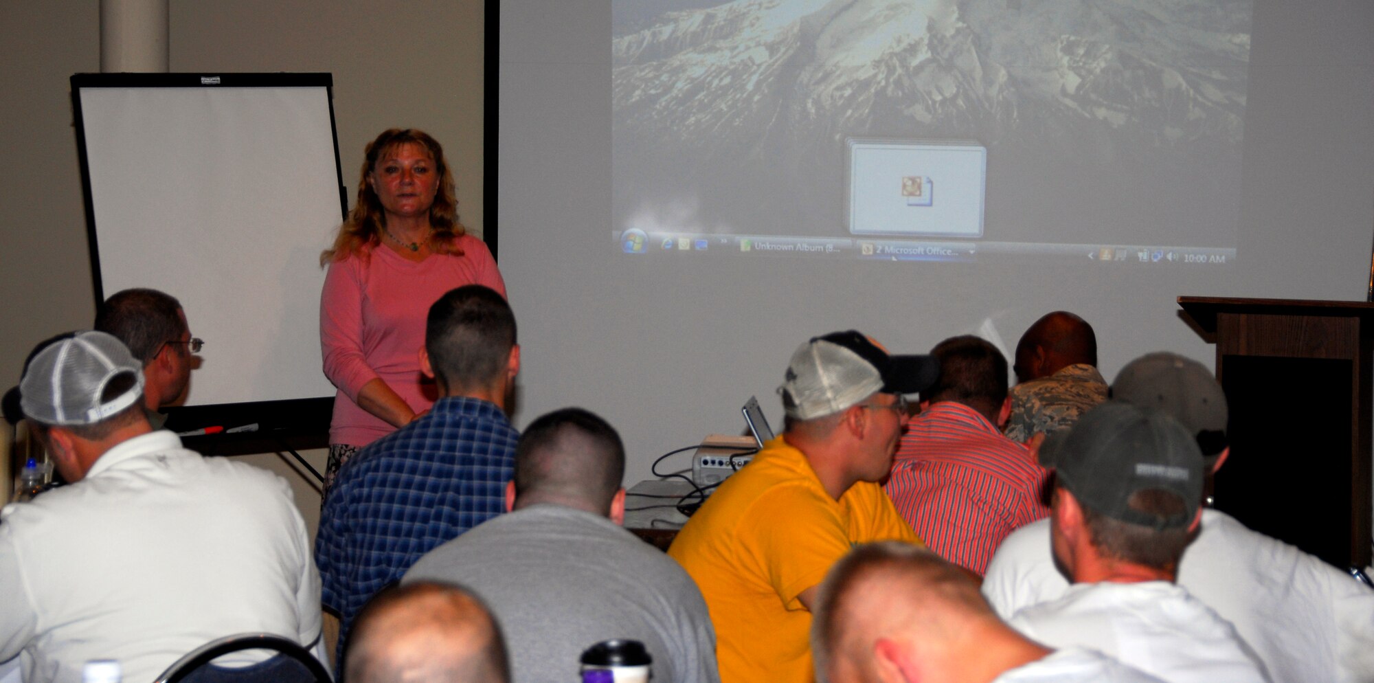 Dr. Mary Sullivan speaks with members of the 148th Fighter Wing Security Forces Squadron on the importance of mental and physical health during a 60-day Yellow Ribbon Reintegration Program event in Duluth, Minn. On Aug. 8, 2010.