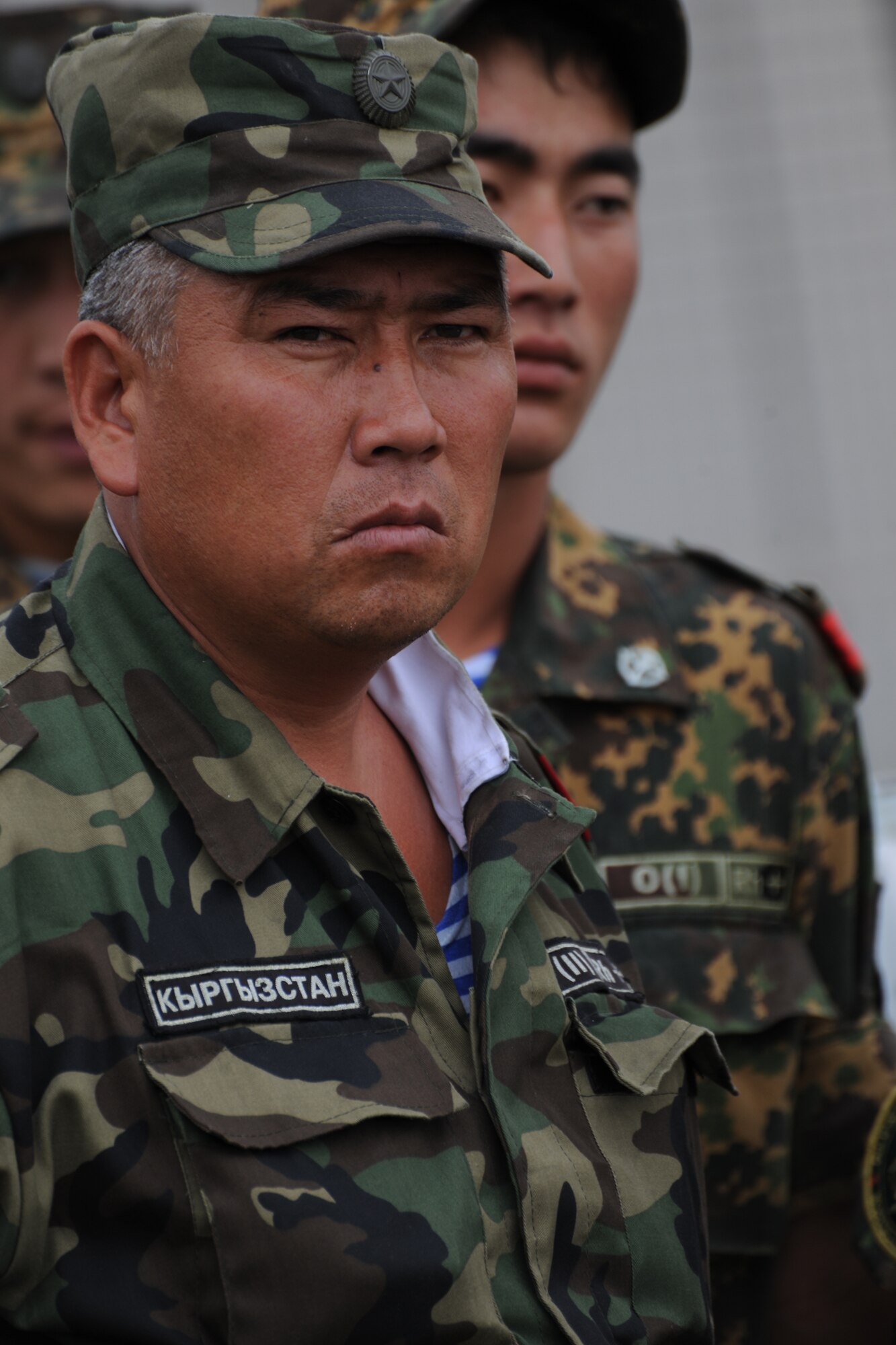 TRANSIT CENTER AT MANAS, Kyrgyzstan ? Chief Sergeant  Murbek Sergeevich Moldaliv listens to the safety briefing on the EOD range Aug. 5. He was one of 14 Kyrgyz EOD students to attend the fourth-ever U.S./Krygyz EOD military to military partnership. (U.S. Air Force Photo/Staff Sgt. Nathan Bevier)