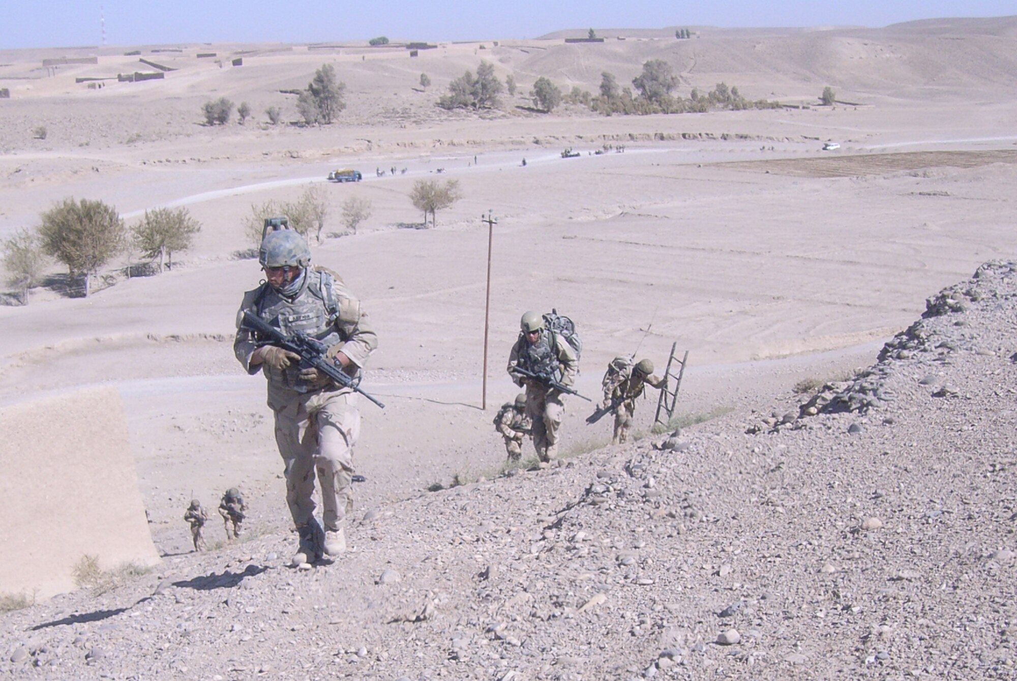 Tech. Sgt. Stephen J. Kaufman (front), a reservist with the 512th Civil Engineer Squadron Explosive Ordnance Disposal Flight team leader at Dover Air Force Base, Del., is on patrol heading to a suspected improvised explosive device in southern Afghanistan. Sergeant Kaufman deployed to Kandahar Airfield, Afghanistan, from September 2009 to March 2010 to provide EOD support to United Kingdom, Danish and Estonian forces in clearing insurgent cells throughout Kandahar, Helmand and Zabul provinces. For his contributions there, he earned the Bronze Star and Air Force Combat Action Medal. (U.S. Air Force photo/submitted photo)                                                      