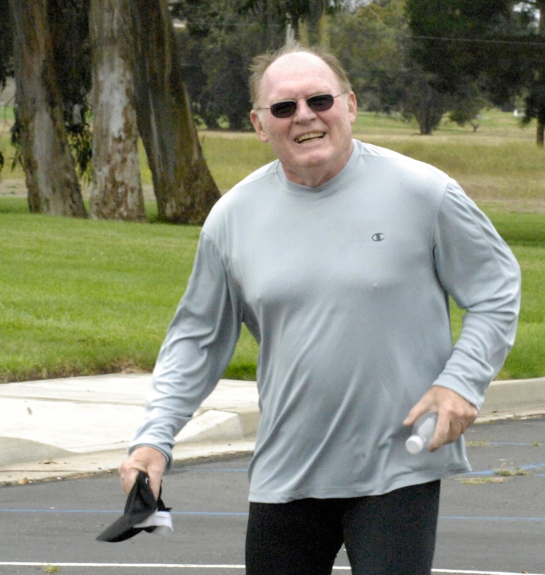 VANDENBERG AIR FORCE BASE, Calif. – Smiling in triumph, Wayne Davis, of the 2nd Range Operations Squadron, finishes the annual base triathlon here Saturday, Aug. 7, 2010. Mr. Davis wins the heat for his age group with a time of 1 hour and 45 minutes. (U.S. Air Force photo/Airman 1st Class Lael Huss)

