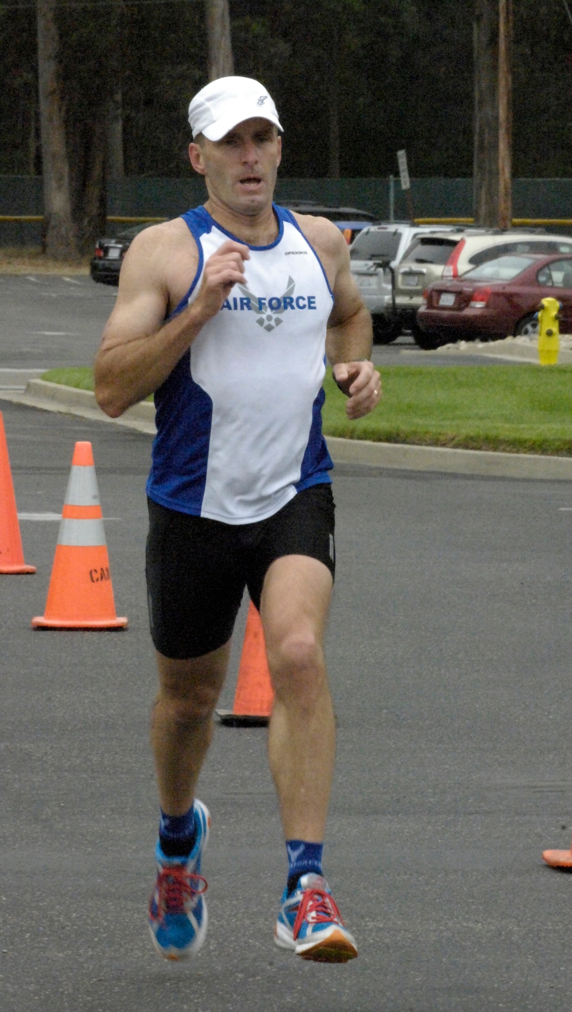 VANDENBERG AIR FORCE BASE, Calif. – Running for the home stretch, Col. Mike Wasson, of the 614th Air and Space Operation Center, takes first place in his group during the annual base triathlon here Saturday, Aug. 7, 2010. Colonel Wasson took home first place after completing a 400 meter swim, 20 kilometer bike ride and a five kilometer run with a time of 1 hour, 8 minutes, 35 seconds.  (U.S. Air Force photo/Airman 1st Class Lael Huss)