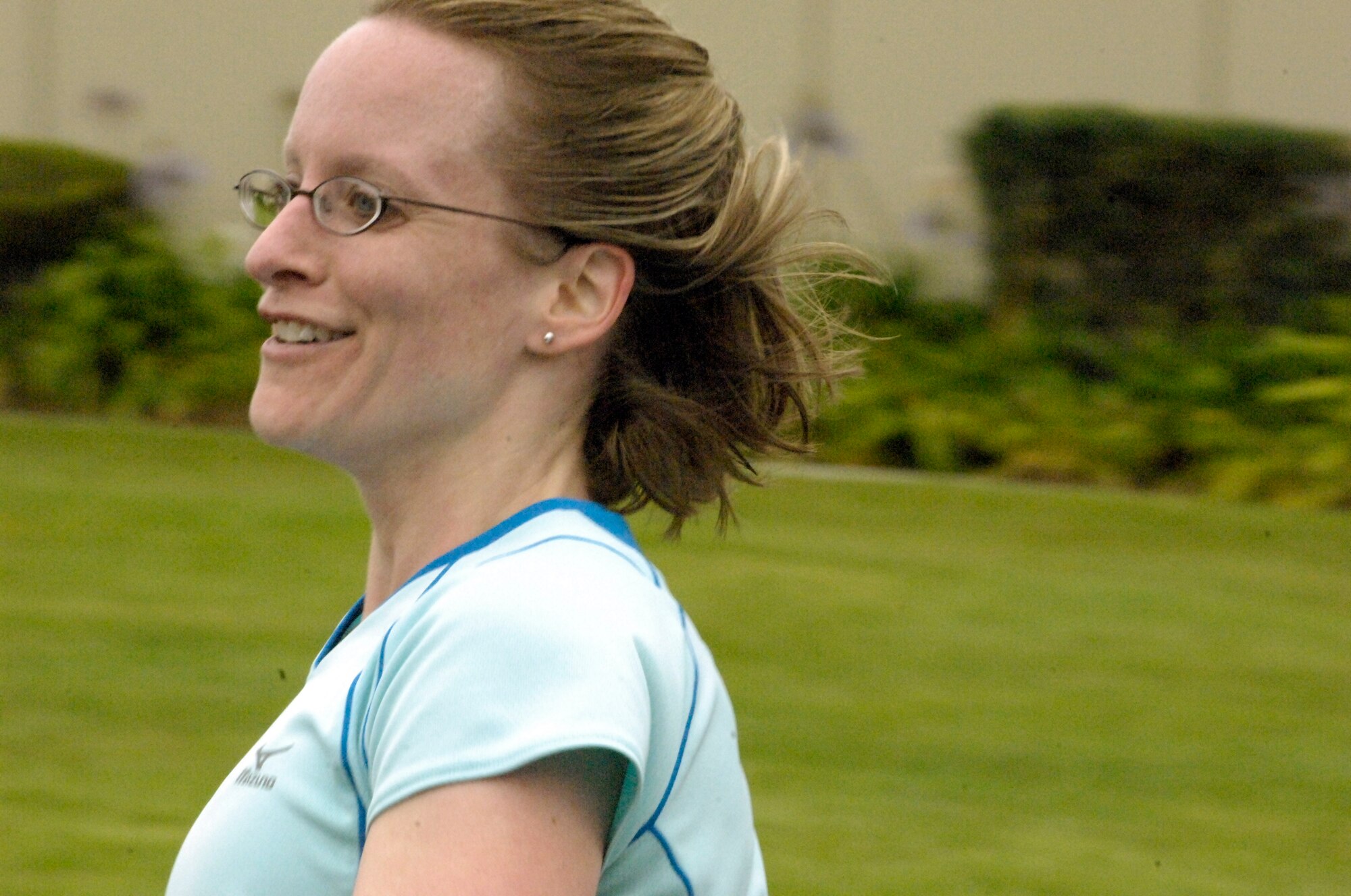 VANDENBERG AIR FORCE BASE, Calif. – Capt. Crescent Seibert, 30th Medical Group, finishes the five kilometer run with a smile on her face at the annual base triathlon here Saturday, Aug. 7, 2010. Ms. Seibert’s team came in fourth place overall with a time of 1 hour, 18 minutes, 9 seconds. (U.S. Air Force photo/Airman 1st Class Lael Huss)