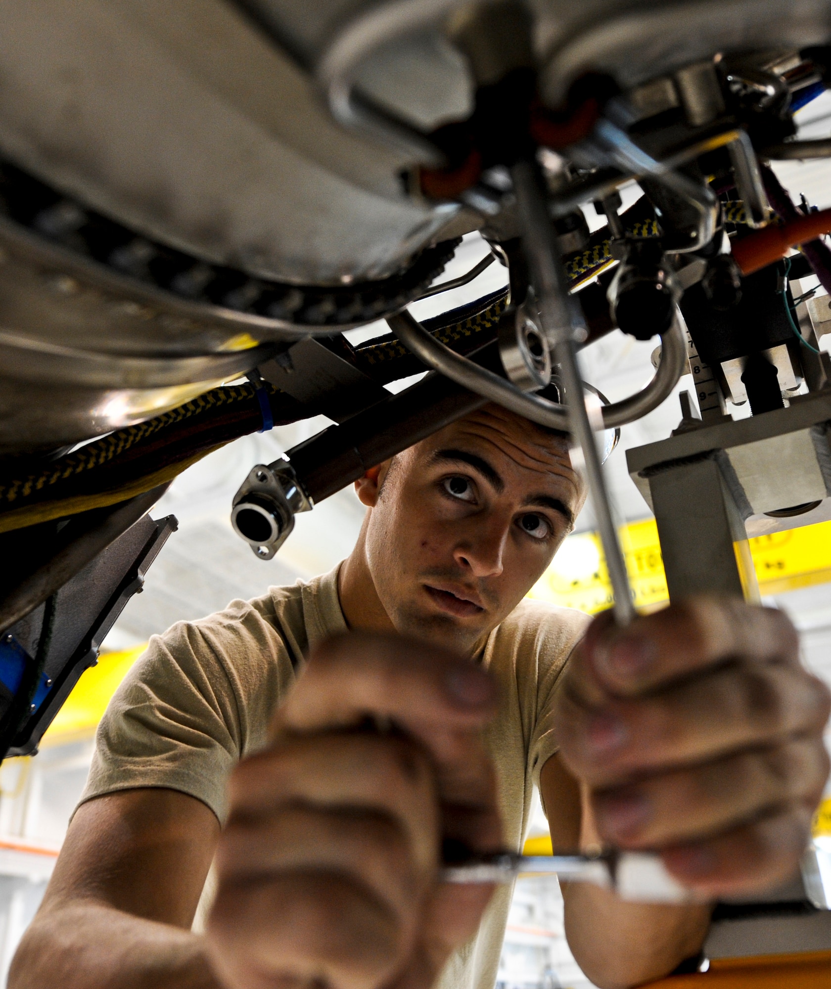 JOINT BASE ELMENDORF-RICHARDSON, Alaska – Airmen 1st Class Justin Bleich, jet mechanic for the 3rd Component Maintenance Squadron Propulsion Flight, performs maintenance on an F-22 Raptor F119-PW-100 engine Aug. 6. The 3rd CMS was recently named the recipients of the 2010 Secretary of Defense Field-Level Maintenance Award, small category. (Air Force photo by Airman 1st Class Christopher Gross)