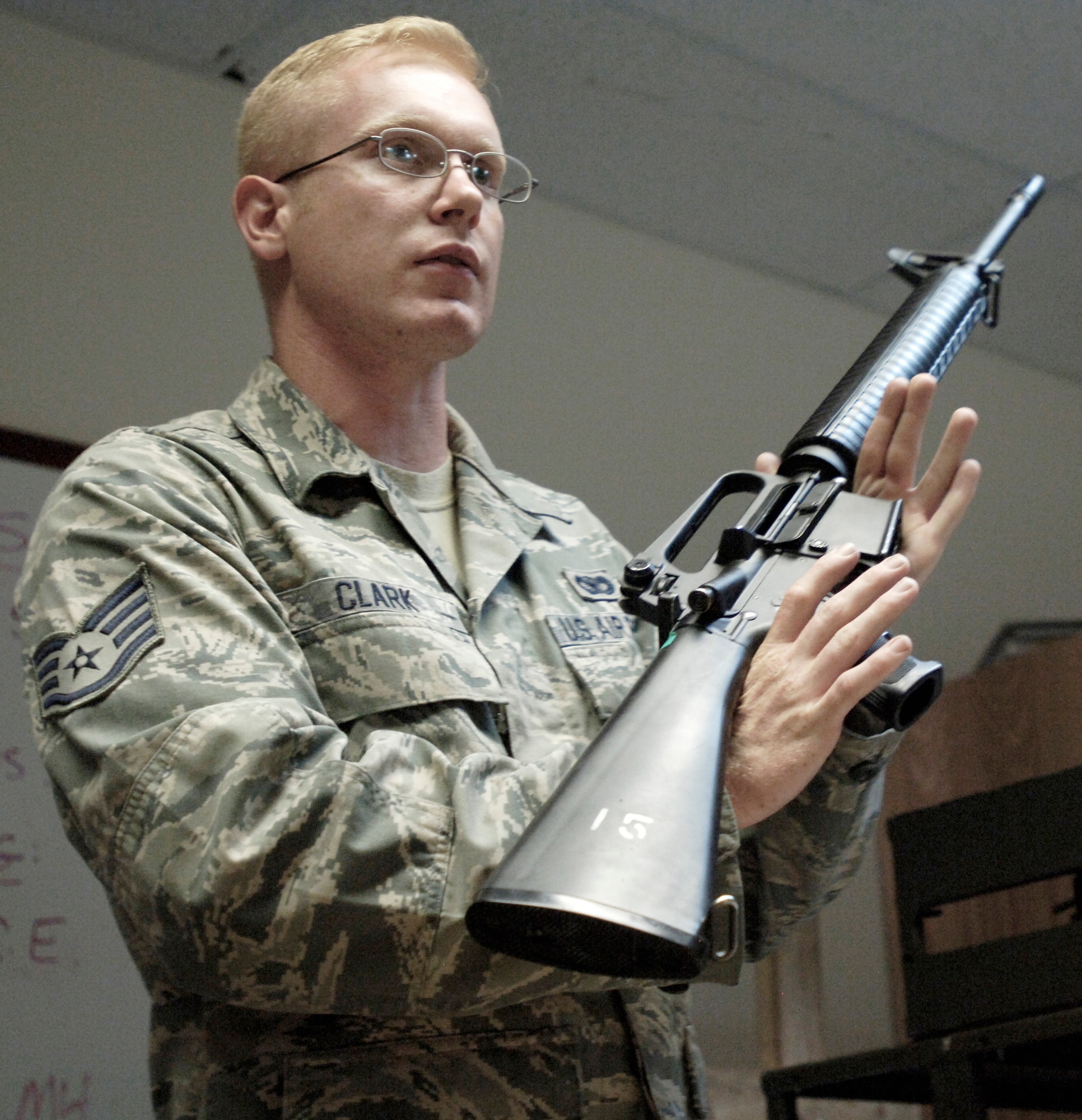 Staff Sgt. Nathaniel Clark demonstrates proper weapons safety and clearing procedures during a M16-A2 qualifications course July 8, 2010, at the combat arms training and maintenance center. Sergeant Clark is a 92nd Security Forces CATM instructor. (U.S. Air Force photos/Airman 1st Class Natasha E. Stannard)