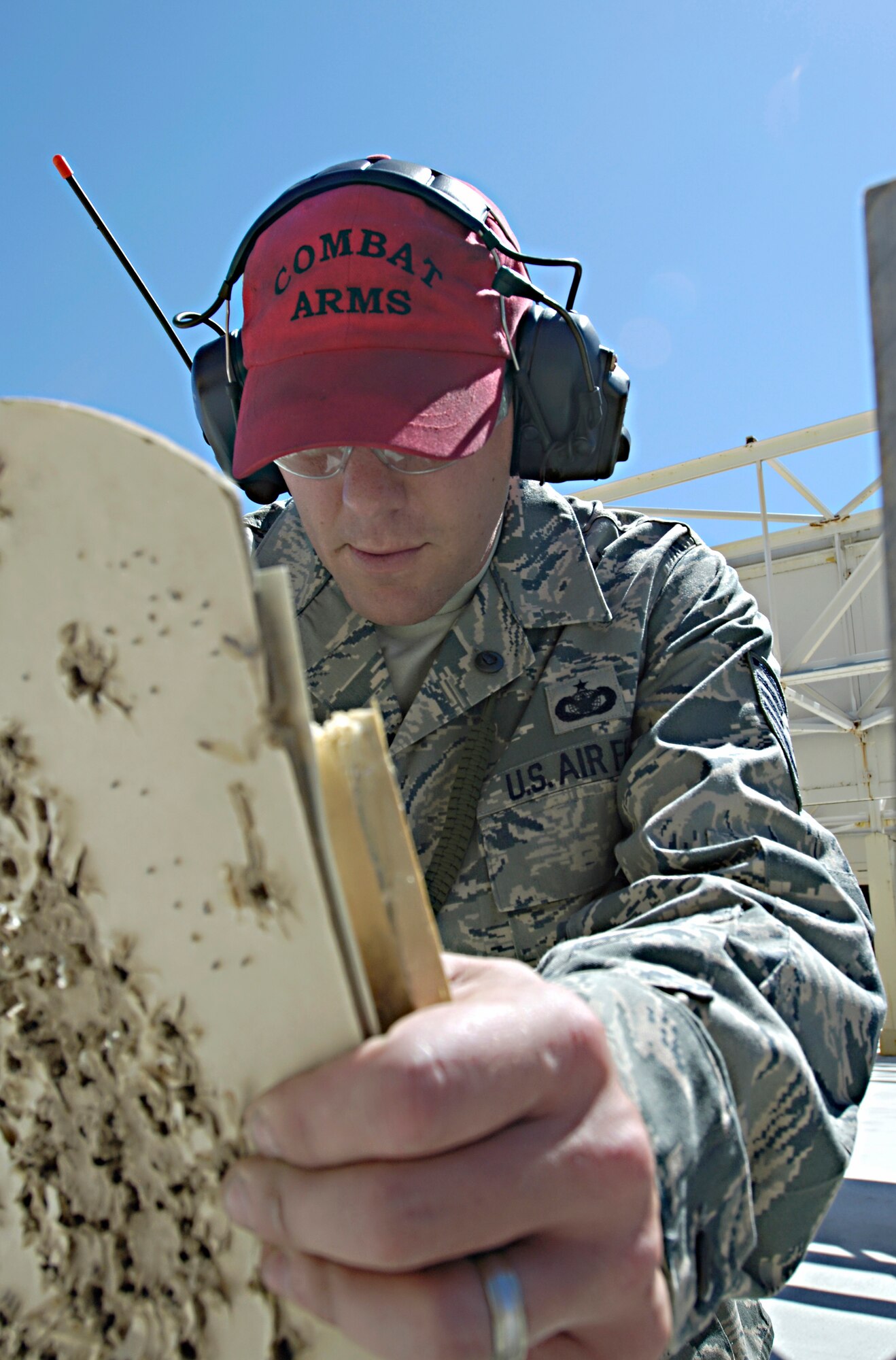 Tech. Sgt. Gregory Stewart tallies up how many targets students accurately hit with M16-A2 rifles July 8, 2010, at the combat arms training and maintenance shooting range. Sergeant Stewart the CATM NCO in charge. (U.S. Air Force photo/Airman 1st Class Natasha E. Stannard)