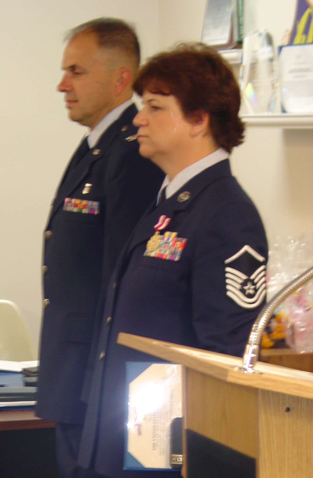 WRIGHT-PATTERSON AIR FORCE BASE, Ohio – Col. Oba Vincent, 445th Aeromedical Staging Squadron commander, stands at attention with Master Sgt. Melanie LaLiberty as the orders are read for the sergeant's Meritorious Medal during their unit’s award ceremony Aug. 8. (U.S. Air Force photo/Maj. Mary Reed)