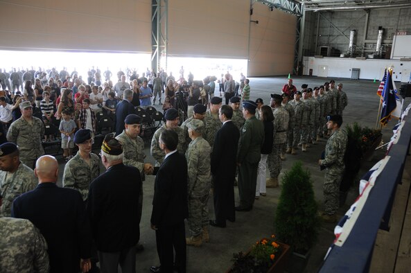 Members of the 102d Intelligence Wing Security Forces say farewell to distinguished visitors, family and friends during a send-off ceremony held August 9, 2010. Approximately 40 members are scheduled to deploy to Iraq in support of Operation Iraqi Freedom. (U.S. Air Force photo/Master Sergeant Sandra Niedzwiecki)