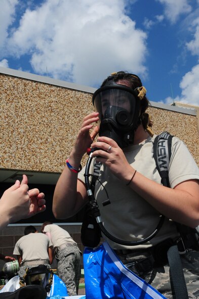 Senior Airman Michelle Schmitt, an Emergency Management Journeyman with the 107th Airlift Wing prepares to enter a simulated "hot-zone" in her level-A ensemble during HAZMAT training at the Niagara Falls Air Reserve Station, NY 