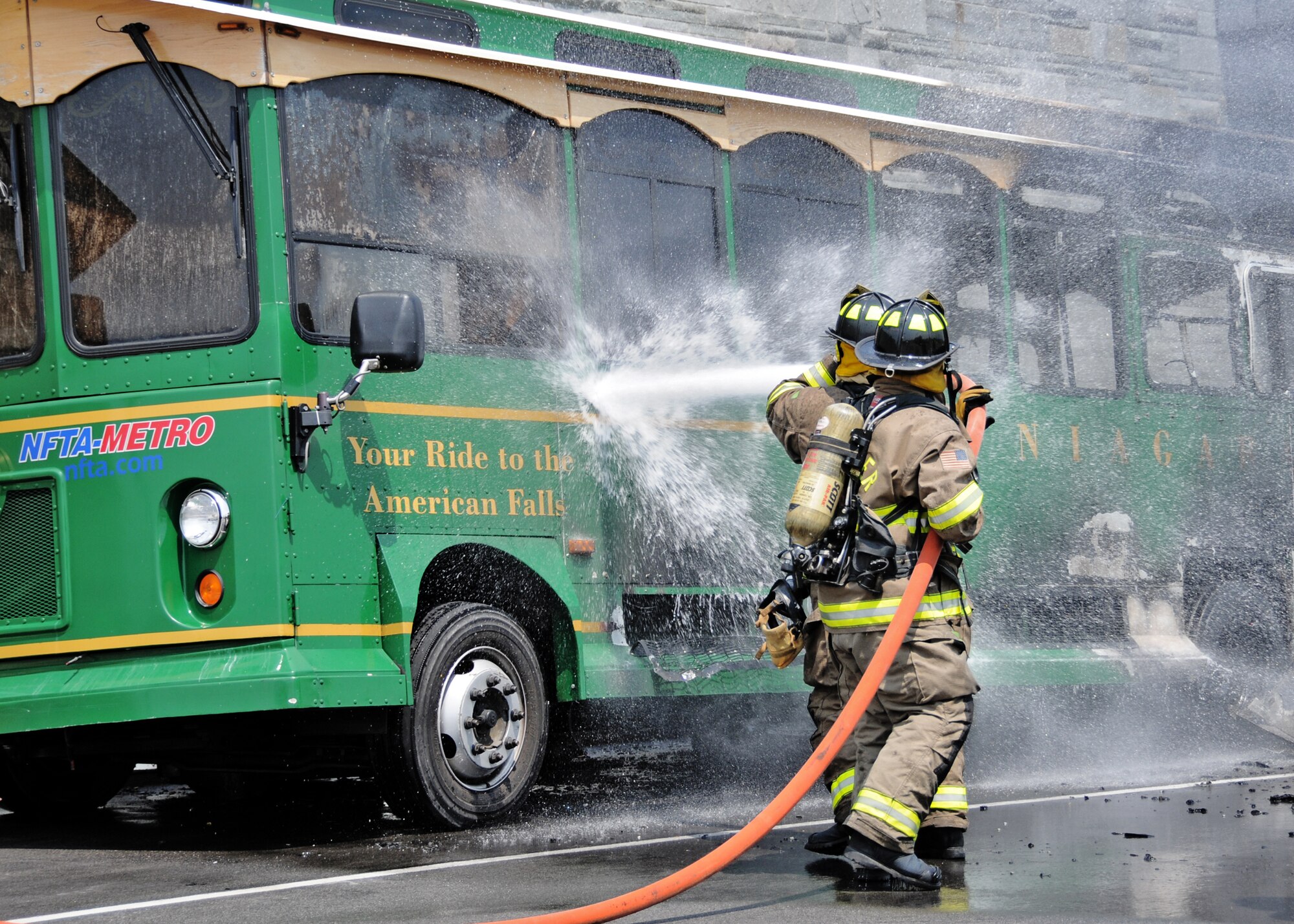 The Niagara Falls Air Reserve Station responded to a fire at the Niagara Falls international Airport on August 2, 2010, Niagara Falls NY. According to reports, one of its replica vintage trolleys caught fire right outside the airport. The trolley was unoccupied during the incident. (U.S. Air Force photo by Staff Sgt. Joseph McKee)
