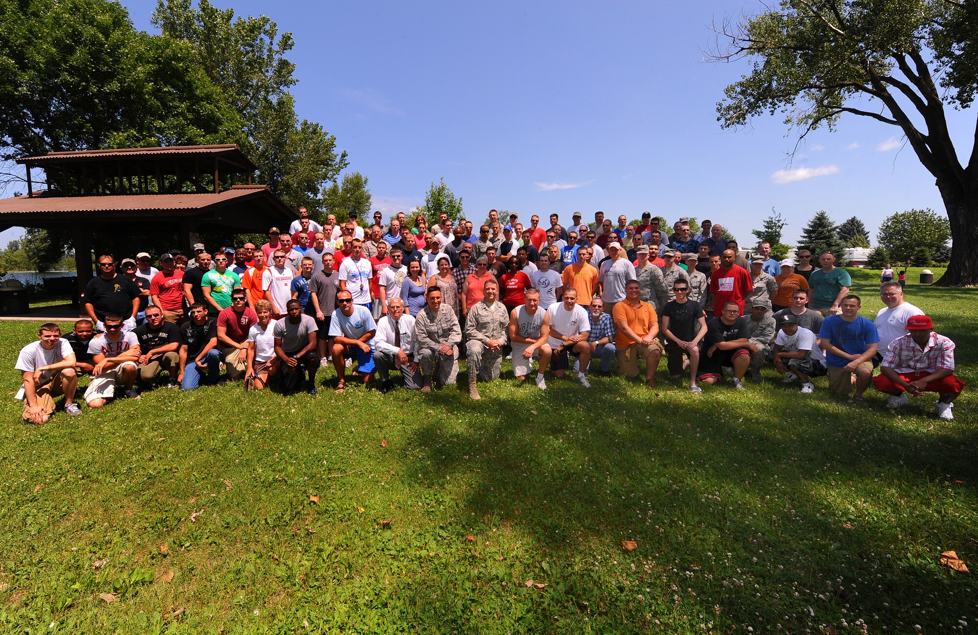 OFFUTT AIR FORCE BASE, Neb. – Members of the 55th Communications Group gather for a photo at their appreciation picnic July 22 at the base lake.  During the event, 55th CG Commander Col. Dennis Lisherness congratulated members of both the 55th Strategic Communications Squadron and 55th Communications Squadron for reaching three and two years respectively without a driving under the influence incident. U.S. Air Force photo by Josh Plueger
