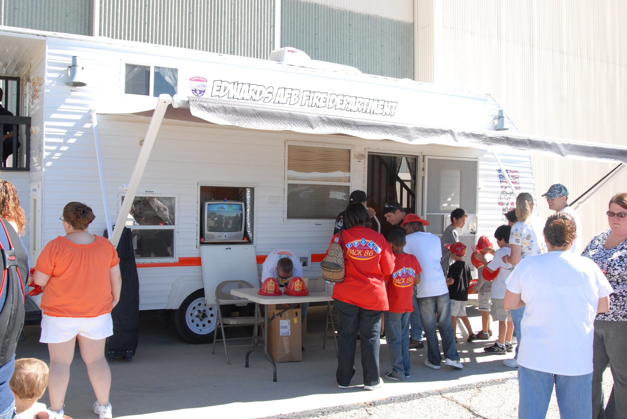 Edwards Fire Department brought two engines and provided fire prevention and first aid training to AFRL family members Aug. 5.  EFD also brought out its fire prevention mobile home, which is used to teach people how to prevent fires at home.  (Air Force photo by Kenji Thuloweit)