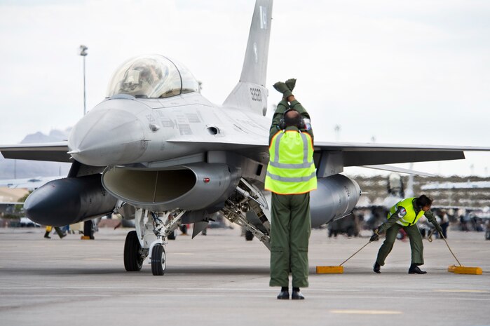 NELLIS AIR FORCE BASE, Nev.--  Pakistan Air Force crew chiefs prepare to launch an F-16 Falcon on July 26.  The U.S. Air Force is hosting approximately 100 Pakistan Air Force pilots and support personnel from Mushaf Air Base in northern Pakistan to fly and train in Red Flag 10-4 and Green Flag 10-9 exercises at Nellis AFB. This is the PAF's first time participating in both exercises.(U.S. Air Force Photo by Lawrence Crespo)
