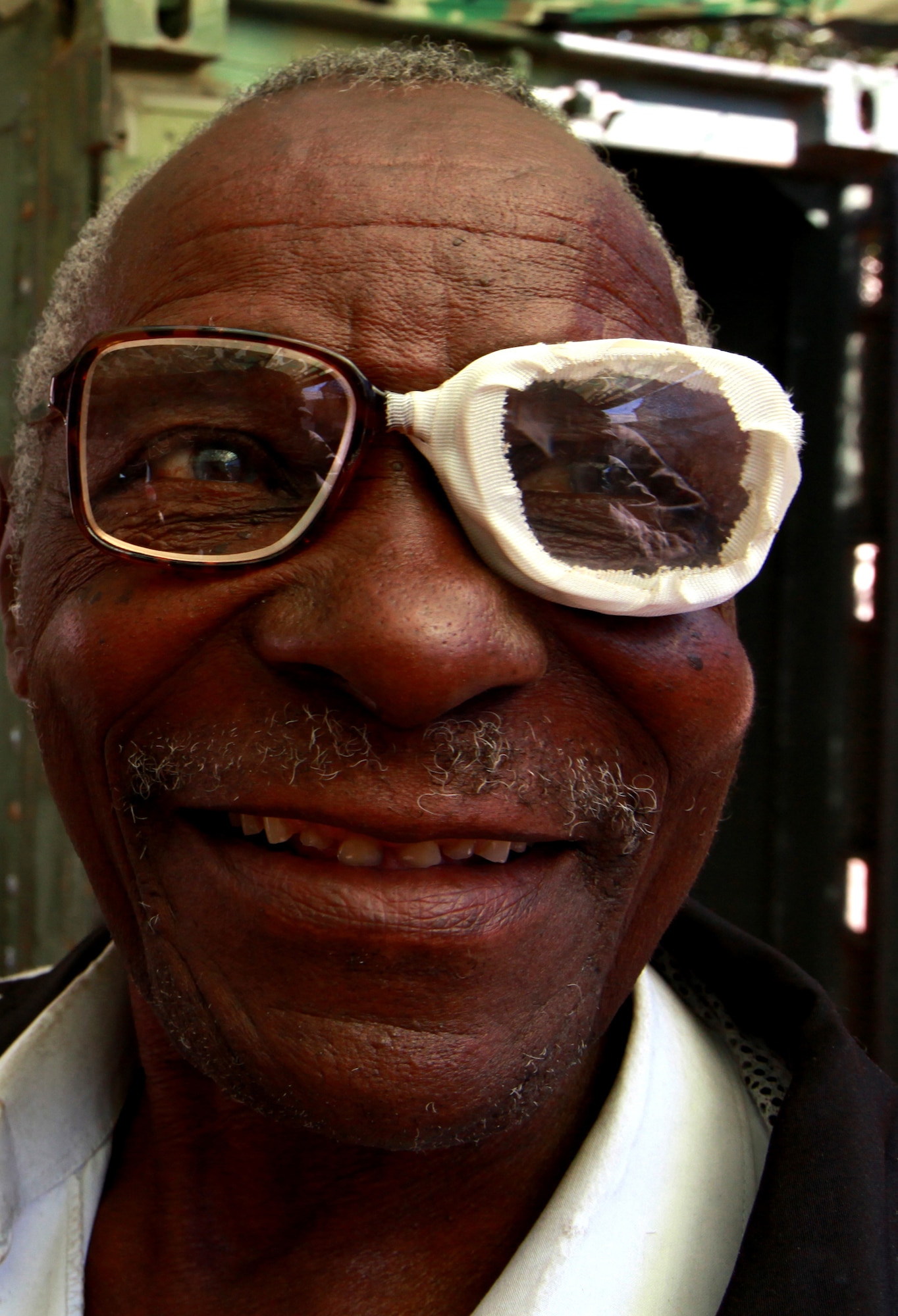 TENGA, Mozambique (August 4, 2010) – Stepahno Shivanbe, a Tenga native, tries on a pair of special dual-lens glasses given to him at the optometry section of the Task Force Unity coordinated humanitarian civil assistance program that began in the tiny village of Tenga Aug. 4 as part of Exercise SHARED ACCORD 2010.  The exercise brings together more than 1,000 U.S. service members and Mozambican soldiers for the purpose of increasing Mozambique’s capacity to carry out peace and stability operations. (Official Marine Corps photo by Lance Cpl. Jad Sleiman)
