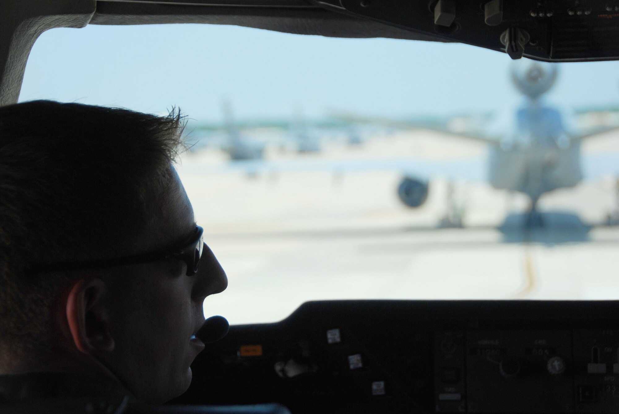 JOINT BASE MCGUIRE-DIX-LAKEHURST, N.J. --In preparation for the Honorary Commanders Flight Capt. Andrew Baer, a member of the 32nd Air Refueling Squadron, communicates with air traffic controllers to insure that all is ready for takeoff. The intent of Honorary Commanders program is to foster a better relationship between the military and local civic leaders, strengthen the community’s understanding of our mission and to reinforce military’s understanding of community issues. (U.S. Air Force Photo/Airman 1st Class Kerelin Molina)