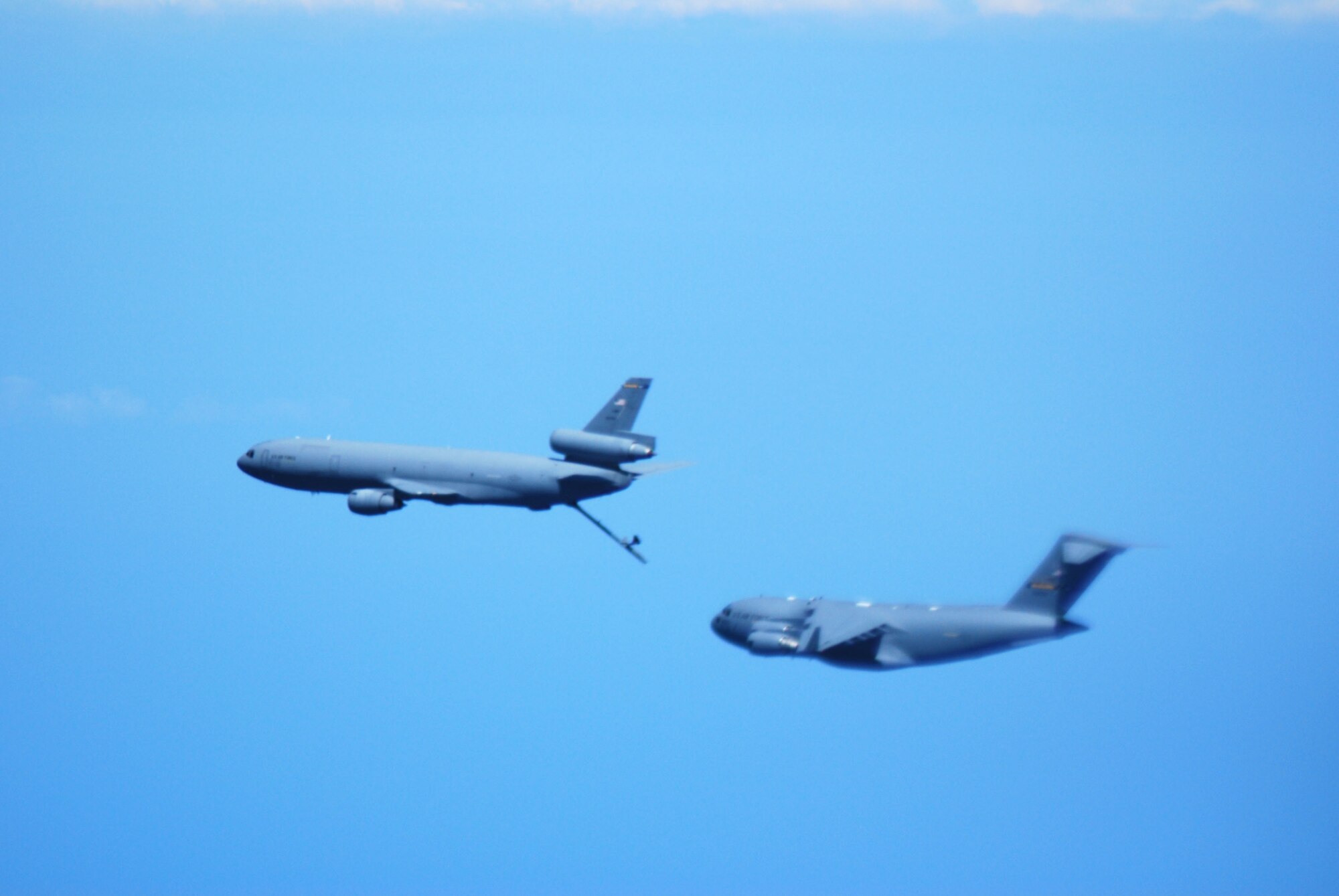 JOINT BASE MCGUIRE-DIX-LAKEHURST, N.J. -- The crew from the 2nd Air Refueling Squadron, get the KC-10 Extender in position to refuel the C-17 Globe Master during Honorary Commanders Flight Saturday, Aug. 7, 2010. The intent of Honorary Commanders program is to foster a better relationship between the military and local civic leaders, strengthen the community’s understanding of our mission and to reinforce military’s understanding of community issues. (U.S. Air Force Photo/Airman 1st Class Kerelin Molina)