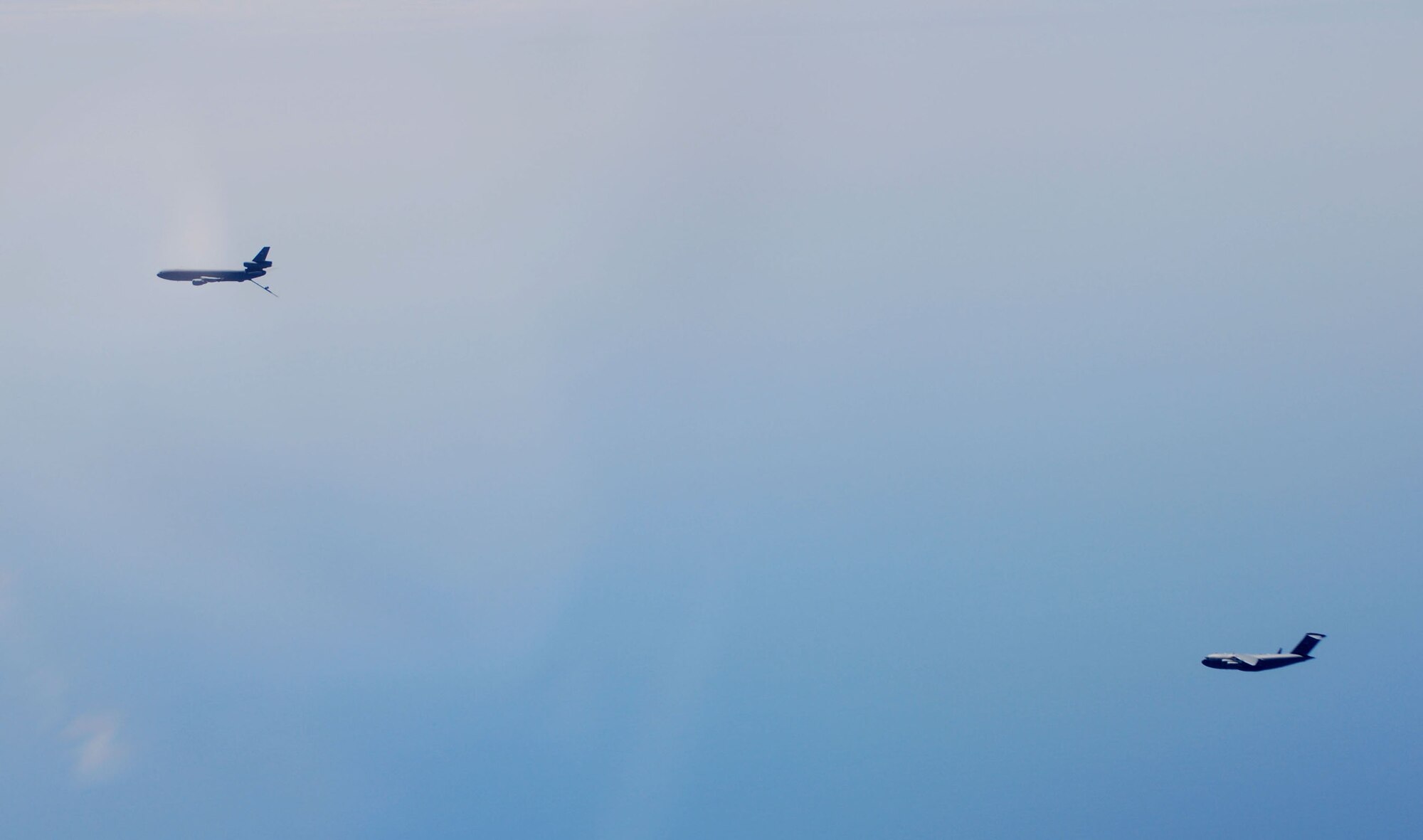 JOINT BASE MCGUIRE-DIX-LAKEHURST, N.J. -- The crew from the 2nd Air Refueling Squadron, get the KC-10 Extender in position to refuel the C-17 Globe Master during Honorary Commanders Flight Saturday, Aug. 7, 2010. The intent of Honorary Commanders program is to foster a better relationship between the military and local civic leaders, strengthen the community’s understanding of our mission and to reinforce military’s understanding of community issues. (U.S. Air Force Photo/Airman 1st Class Kerelin Molina)