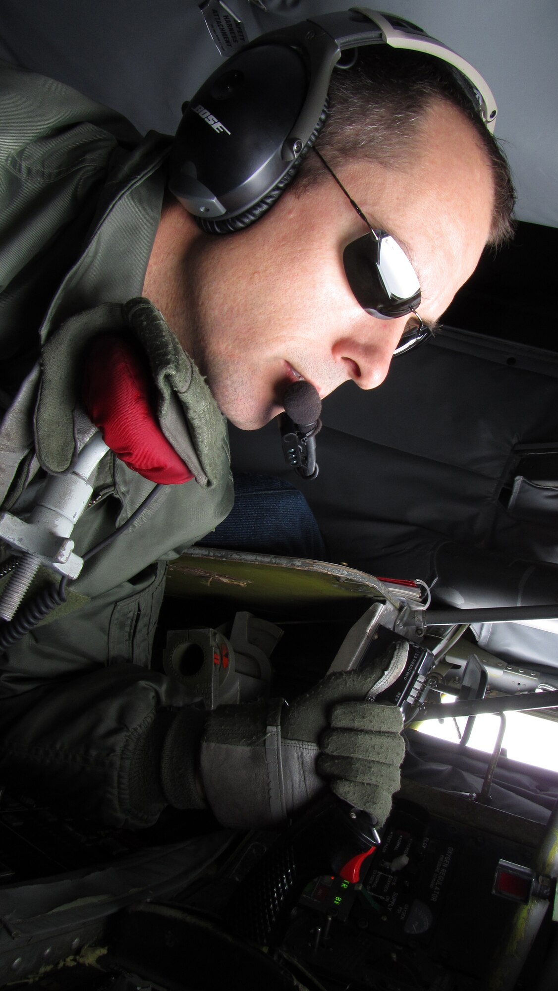 RAF MILDENHALL, England -- Tech. Sgt. Randy Stinnett, 100th Air Refueling Wing, checks out the controls of his KC-135 refueling boom before the arrival of recipient aircraft Aug. 5.  The mission was in support of Allied Strike, a multinational exercise which ran from Aug. 2 to 5, and involved American, Belgian and German aircraft.  (U.S. Air Force photo/Staff Sgt. Austin M. May)