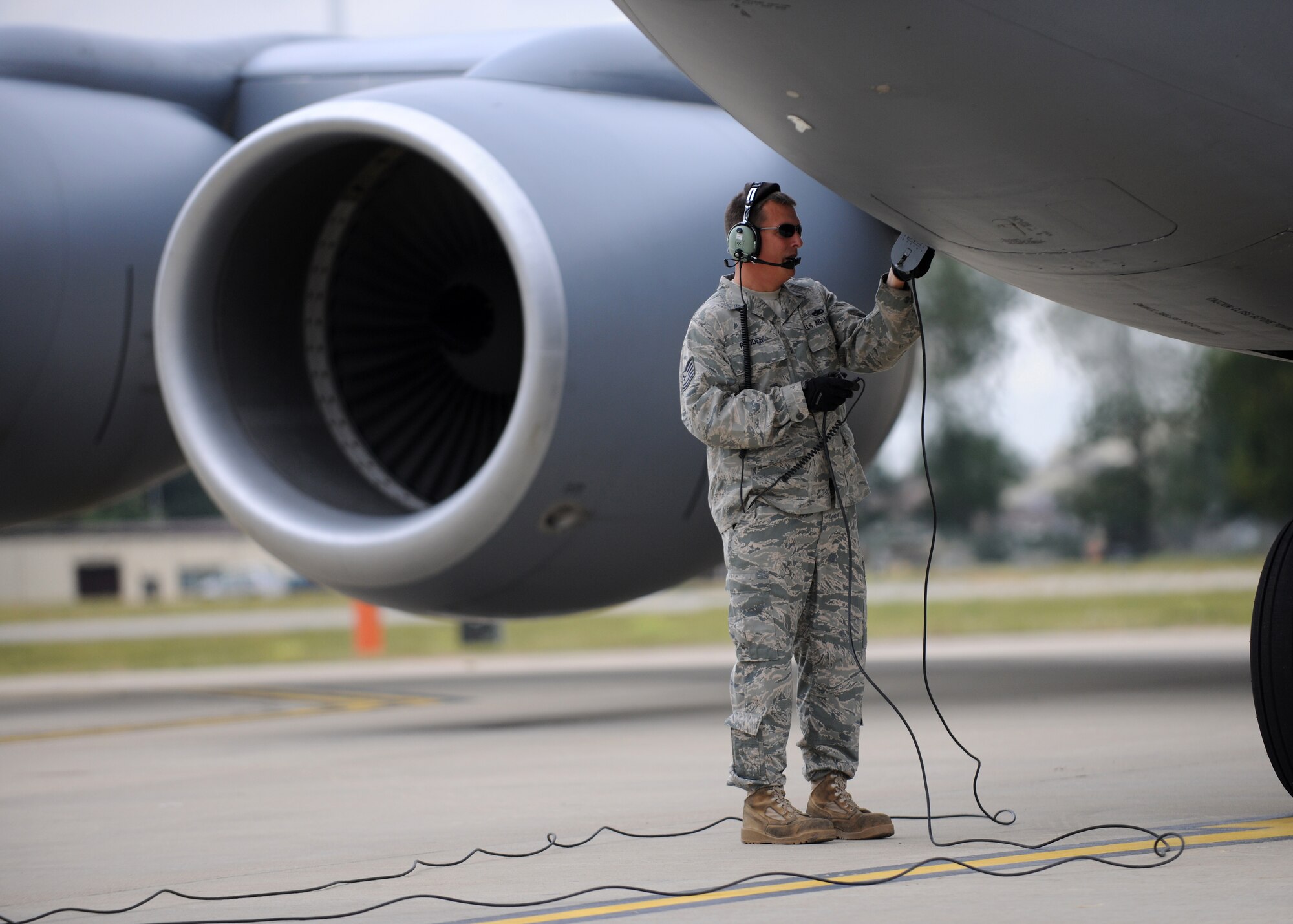 RAF MILDENHALL, England – Tech. Sgt. Ray Rhodes, 100th Aircraft Maintenance Squadron flying crew chief, disconnects communications during launch procedures in support of the Allied Strike exercise Aug. 5. Allied Strike is Europe’s premier annual close air support exercise that helps build partnership capacity among allied NATO nations and joint services. (U.S. Air Force photo/ Staff Sgt. Jerry Fleshman)