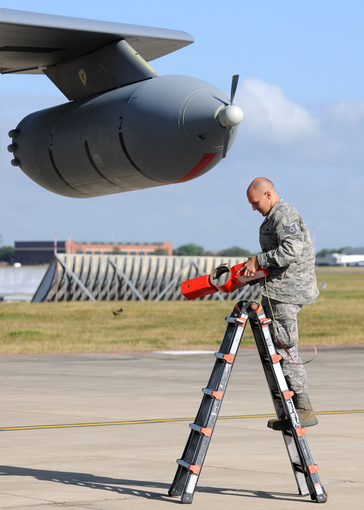 RAF MILDENHALL, England – Tech. Sgt. Adam Hagar, 100th Aircraft Maintenance Squadron crew chief, removes the cover from a multi point refueling system during prelaunch preparations in support of the Allied Strike exercise Aug. 5. Allied Strike is Europe’s premier annual close air support exercise that helps build partnership capacity among allied NATO nations and joint services. (U.S. Air Force photo/ Staff Sgt. Jerry Fleshman)