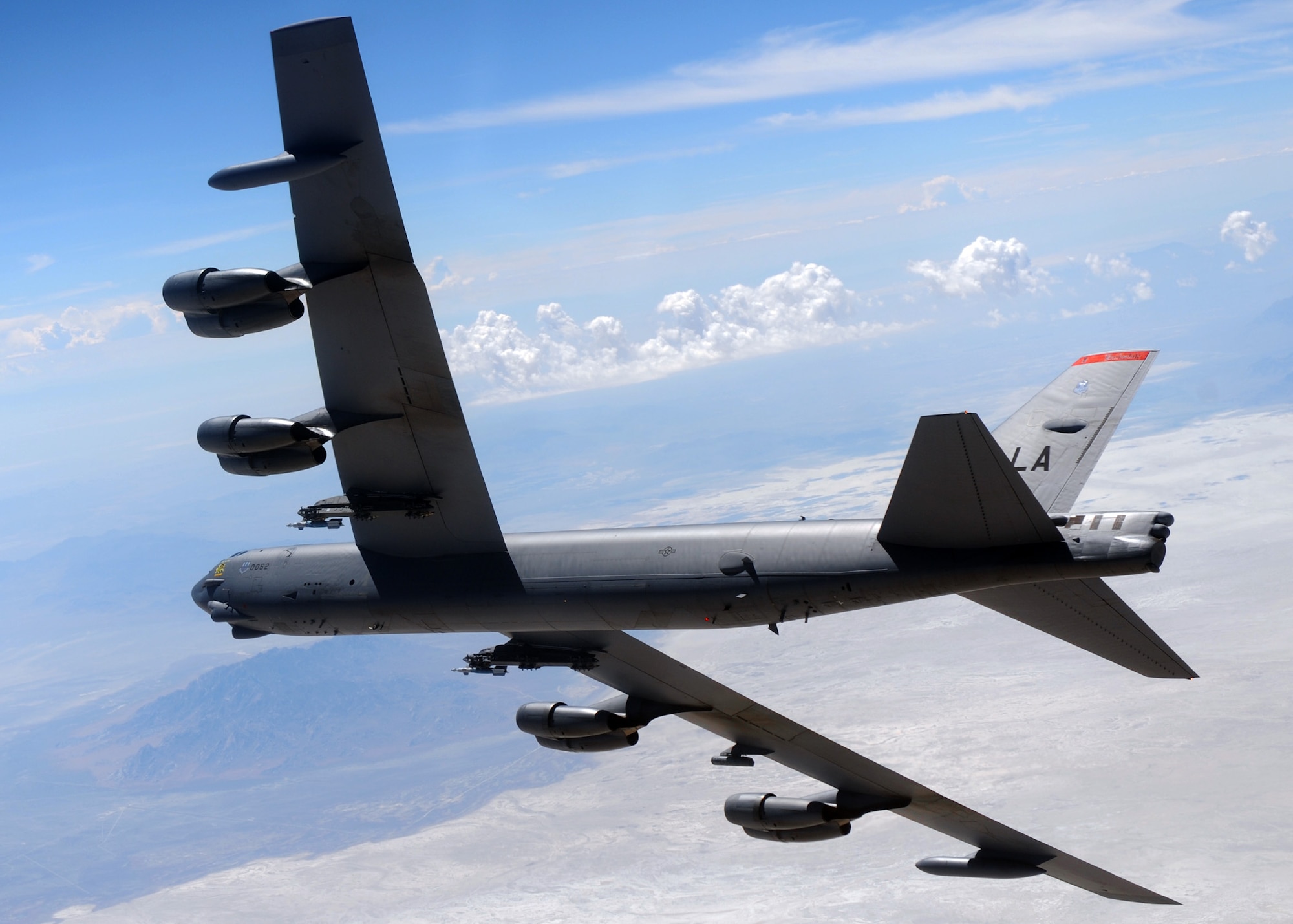 A B-52 Stratofortress from the 2nd Bomb Wing banks right during a Combat Hammer mission at Hill Air Force Base, Utah.  Combat Hammer is an air-to-ground Weapons System Evaluation Program maintained by the 86th Fighter Weapons Squadron.  Combat Hammer marked the first of three weeks of evaluation at Hill AFB by the 53rd Weapons Evaluation Group.  Combat Archer, an air-to-air evaluation, is the second week, followed by a combined air and ground WSEP in the final week.  The WSEP program is used to evaluate the effectiveness and suitability of combat air force weapon systems. The evaluations are accomplished during tactical deliveries of fighter, bomber and unmanned aerial system precision guided munitions, on realistic targets with air-to-air and surface-to-air defenses. For many of the aircrew participating in WSEP, it is the first time employing live weapons. This provides a level of combat experience many units face during combat. (Courtesy photo.)
