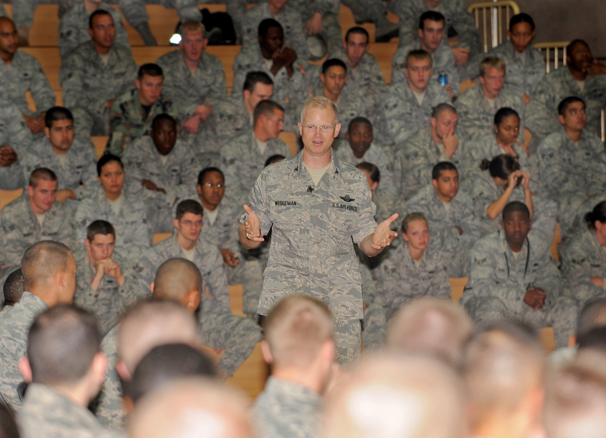 SPANGDAHLEM AIR BASE, Germany – Col. Christopher P. Weggeman, 52nd Fighter Wing commander briefs Airmen during a commander’s call for Senior Airmen and below Aug. 5. Colonel Weggeman briefed 52 FW Airmen on the wing mission and his expectations. (U.S. Air Force photo/Airman 1st Class Nick Wilson)