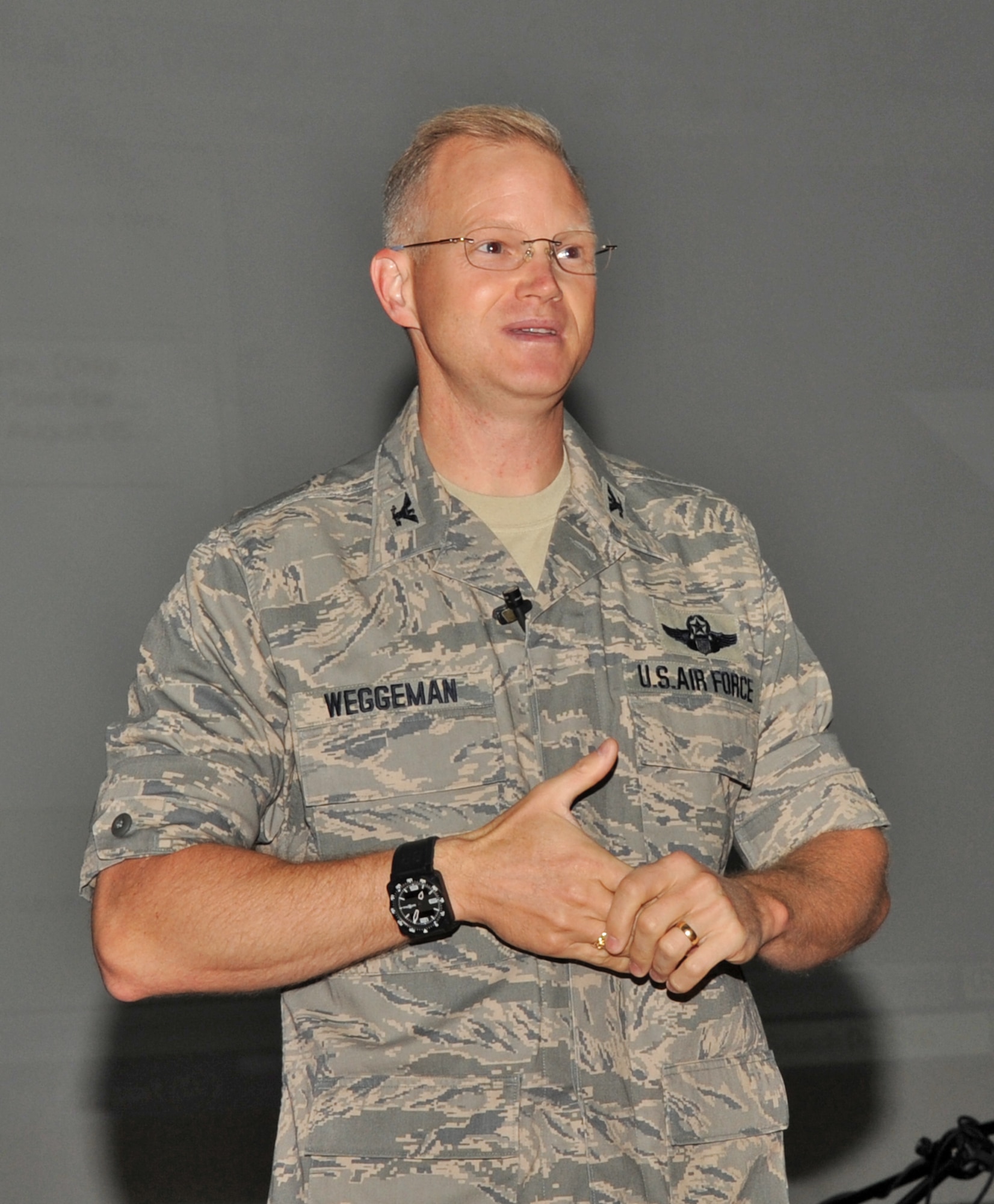 SPANGDAHLEM AIR BASE, Germany – Col. Christopher P. Weggeman, 52nd Fighter Wing commander briefs Airmen during a commander’s call for Senior Airmen and below Aug. 5. Colonel Weggeman briefed 52 FW Airmen on the wing mission and his expectations. (U.S. Air Force photo/Airman 1st Class Nick Wilson)