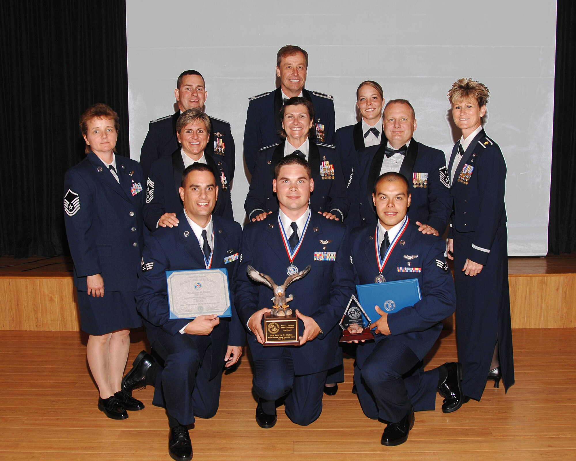 WRIGHT-PATTERSON AIR FORCE BASE, Ohio - From left to right, front row:  Senior Airman, now Staff Sgt., Robert Nelson, 445 Airlift Wing Public Affairs, Senior Airman Justin Staten, 445th Aeromedical Evacuation Squadron, and Senior Airman Eddie Mulkey, 445th Aeromedical Evacuation Squadron, graduated from Airman Leadership School July 7.  Airman Mulkey captured the Commandant's Award and Airman Staten the John L. Levitow Award. (U.S. Air Force photo/Ben Strasser)