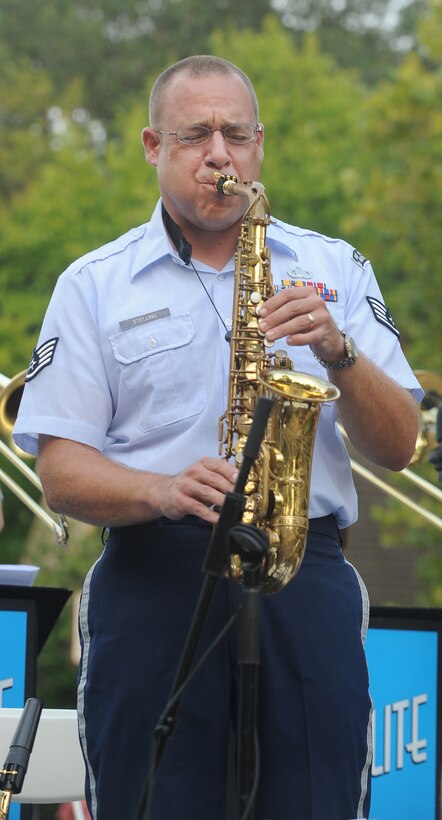 Williamsburg, Va. – Staff Sgt. Christopher Stelling, Langley Air Force Base Heritage of America band, plays the saxophone at the Merchants Square during the Satellite Jazz Ensemble, Aug. 4. The band is scheduled to perform free concerts at Merchants Square in Williamsburg every Wednesday in the month of August, starting at 7pm. (U.S. Air Force photo/Senior Airman Gul Crockett)