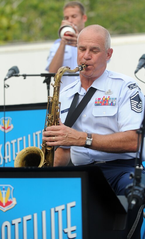 Williamsburg, Va. --Master Sgt. Allen Wittig, Langley Air Force Base Heritage of America band, plays the saxophone at the Merchants Square during the Satellite Jazz Ensemble, Aug. 4. The band is scheduled to perform free concerts at the Merchants Square in Williamsburg every Wednesday in the month of August, starting at 7 p.m. (U.S. Air Force photo/Senior Airman Gul Crockett)