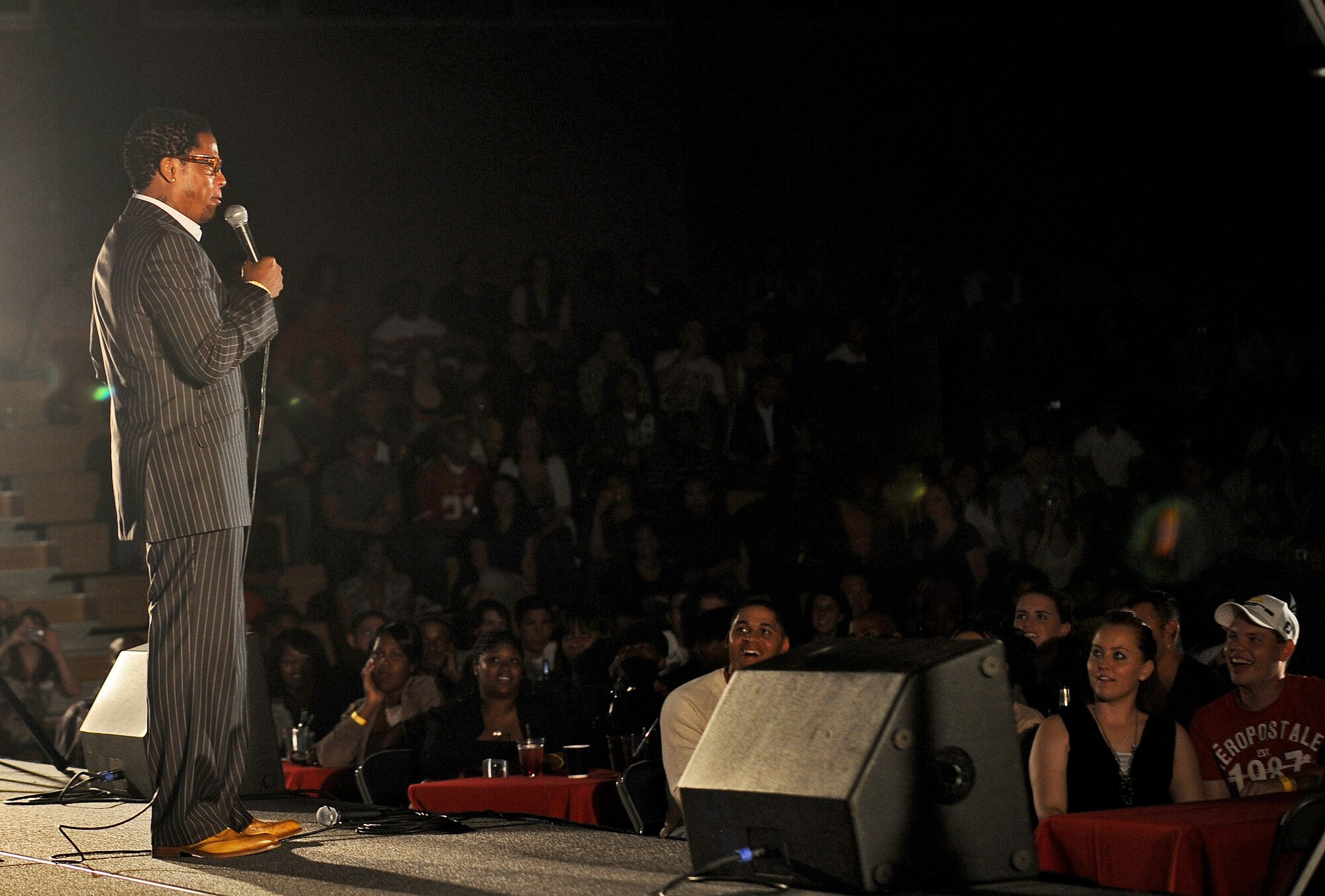 SPANGDAHLEM AIR BASE, Germany – SPANGDAHLEM AIR BASE, Germany – Comedian D.L. Hughley performs at the Skelton Memorial Fitness Center Aug. 6. Hughley and comedian Bryan Ricci provided a free show for members of the 52nd Fighter Wing, with approximately 625 Sabers at the show. (U.S. Air Force photo/Senior Airman Nick Wilson)