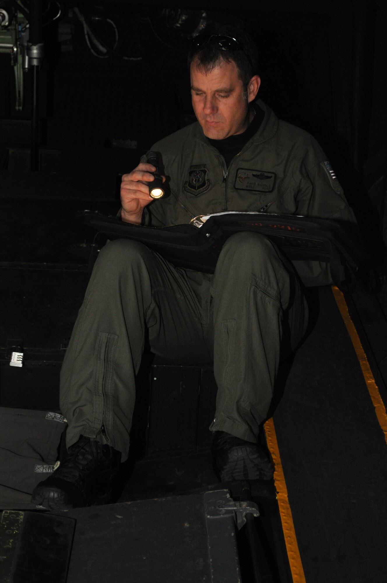RAF MILDENHALL, England – Master Sgt. David Nichols, 67th Special Operations Squadron flight engineer, reviews maintenance forms during an aircraft pre-flight.  Sergeant Nichols is part of an MC-130P Combat Shadow crew that departed for Germany on Aug 4, in support of exercise ALLIED STRIKE 10.  The crew will be providing refueling support to the 56th Rescue Squadron, RAF Lakenheath’s two HH-60G helicopters currently participating in the exercise.  (U.S. Air Force photo by Tech. Sgt. Marelise Wood)