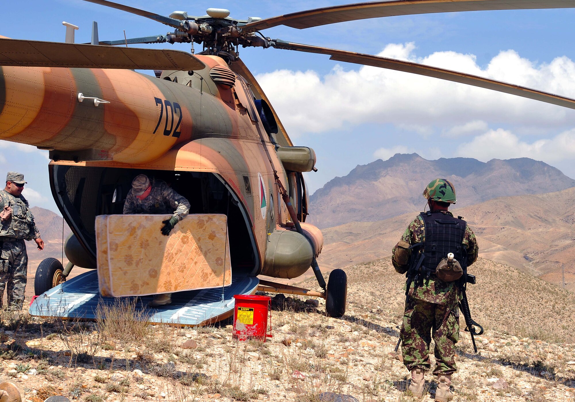 100809-N-6031Q-006 KABUL, Afghanistan - Airmen from the Afghan Air Force 201st Corps, the U.S. Air Force 438th Air Expeditionary Wing and the 438th Air Expeditionary Advisory Wing prepared and delivered humanitarian aid consisting of school supplies for 600 students, sporting equipment, bedding, a large tent, and an all weather Afghanistan flag to the Chinari village in the outskirts of Kabul, Afghanistan on Aug. 9, 2010. (US Navy photo by Mass Communication Specialist 2nd Class David Quillen/ RELEASED).