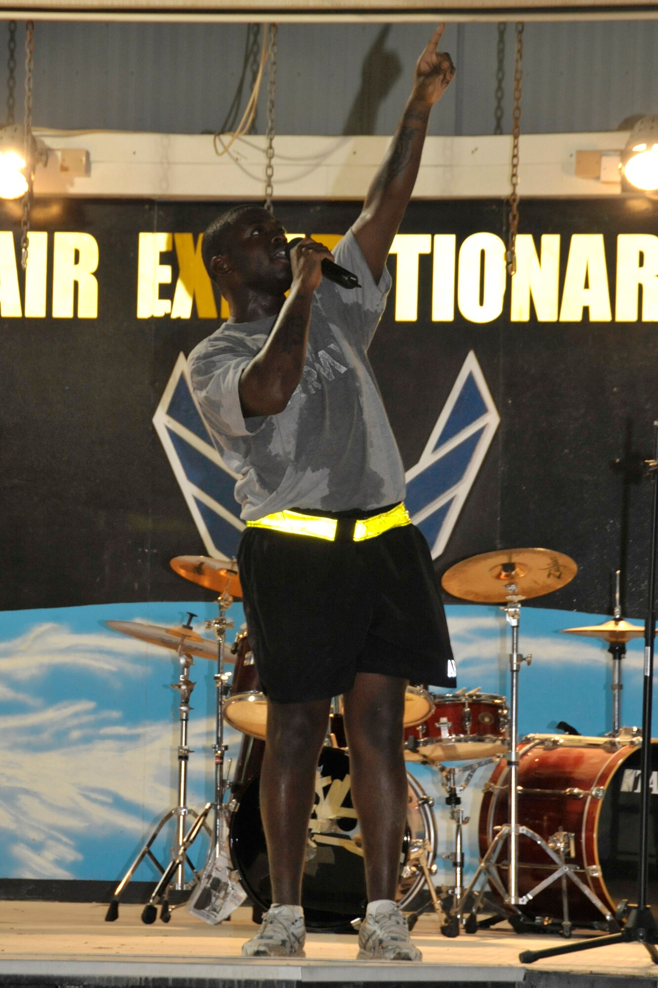 A Soldier performs during Open Mic Night Aug. 6 at an undisclosed location in Southwest Asia. Airmen and Soldiers participated in the event by singing, playing musical instruments, rapping, dancing and performing comedy routines. (U.S. Air Force photo/Tech. Sgt. April Wickes)