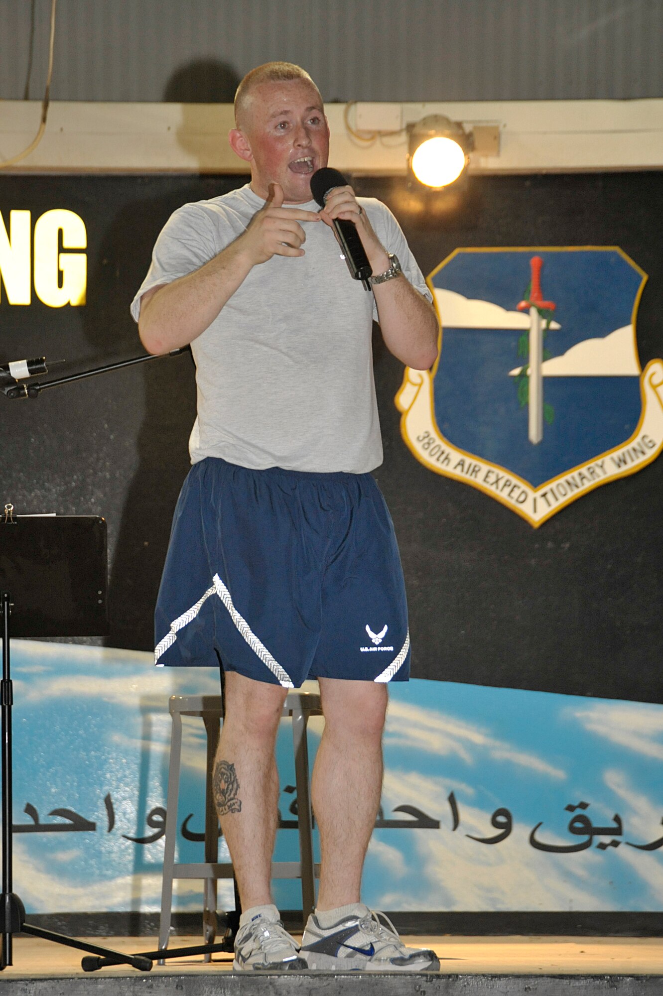Senior Airman Jimmy Atwater, 380th Expeditionary Communications Squadron, raps during Open Mic Night Aug. 6 at an undisclosed location in Southwest Asia. Airmen and Soldiers participated in the event by singing, playing musical instruments, rapping, dancing and performing comedy routines. (U.S. Air Force photo/Tech. Sgt. April Wickes)