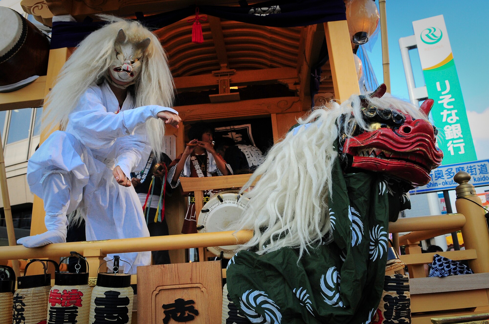 YOKOTA AIR BASE, Japan -- Performers dance and sing during the Fussa Tanabata Festival Aug. 6. The festival itself featured a number of different groups carrying Mikoshi (shrines) and mobile stages featuring performances of traditional Japanese characters such as a fox and an Oni, or a demon. At many points during the march the groups would raise the shrines and cheer in front of the stages. The festival included performances of traditional Japanese dancing and the carrying of shrines from Shinmeisya Shrine to Fussa City Hall. (U.S.Air Force photo/Staff Sgt. Stacy Moless)