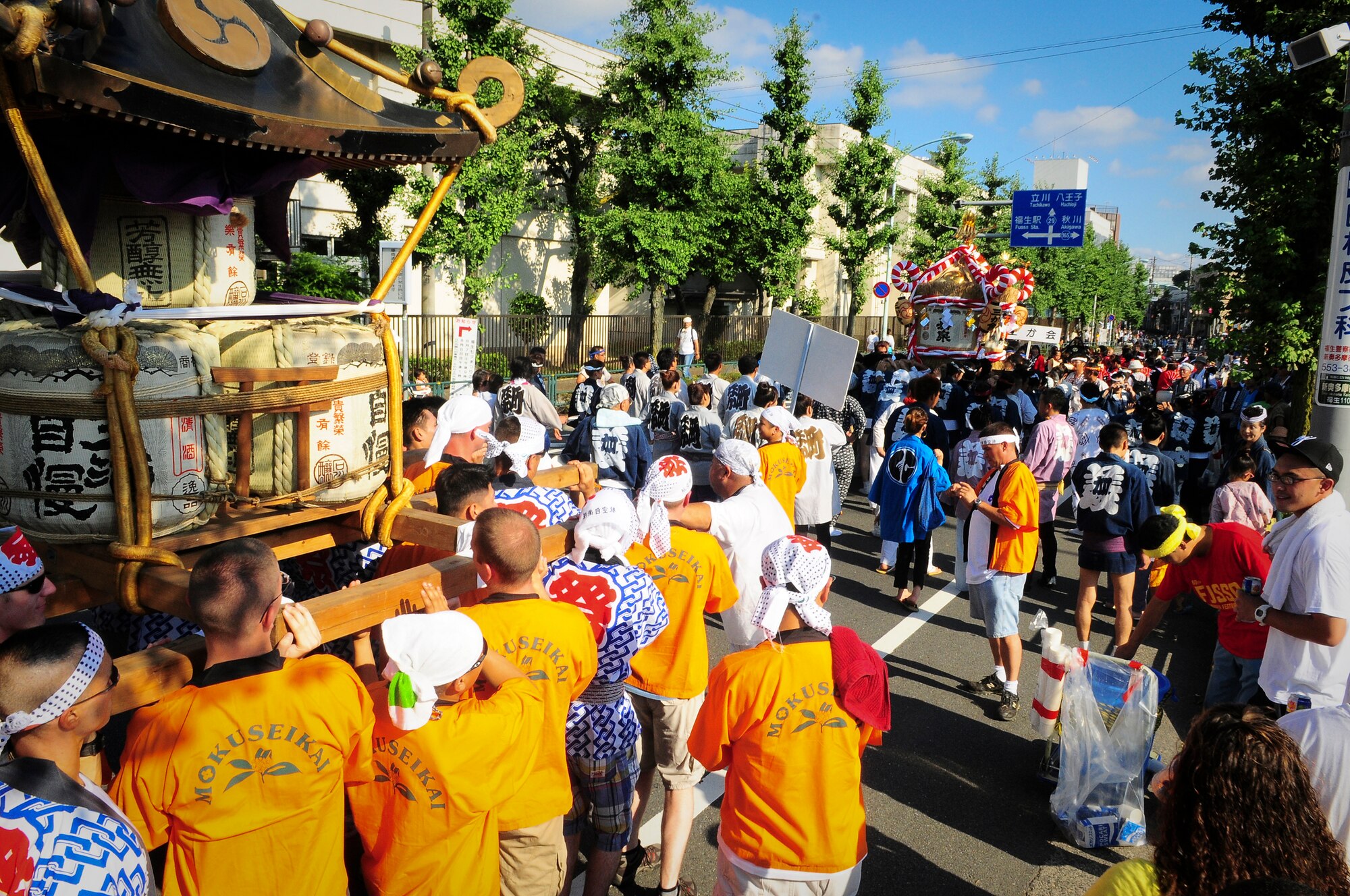 YOKOTA AIR BASE, Japan -- Military Members from Yokota Air Base, Japan participated in the Fussa City Tanabata Festival Aug. 6. The festival itself featured a number of different groups carrying Mikoshi (shrines) and mobile stages featuring performances of traditional Japanese characters such as a fox and an Oni, or a demon. At many points during the march the groups would raise the shrines and cheer in front of the stages. The festival included performances of traditional Japanese dancing and the carrying of shrines from Shinmeisya Shrine to Fussa City Hall (U.S. Air Force photo/Staff Sgt. Stacy Moless)
